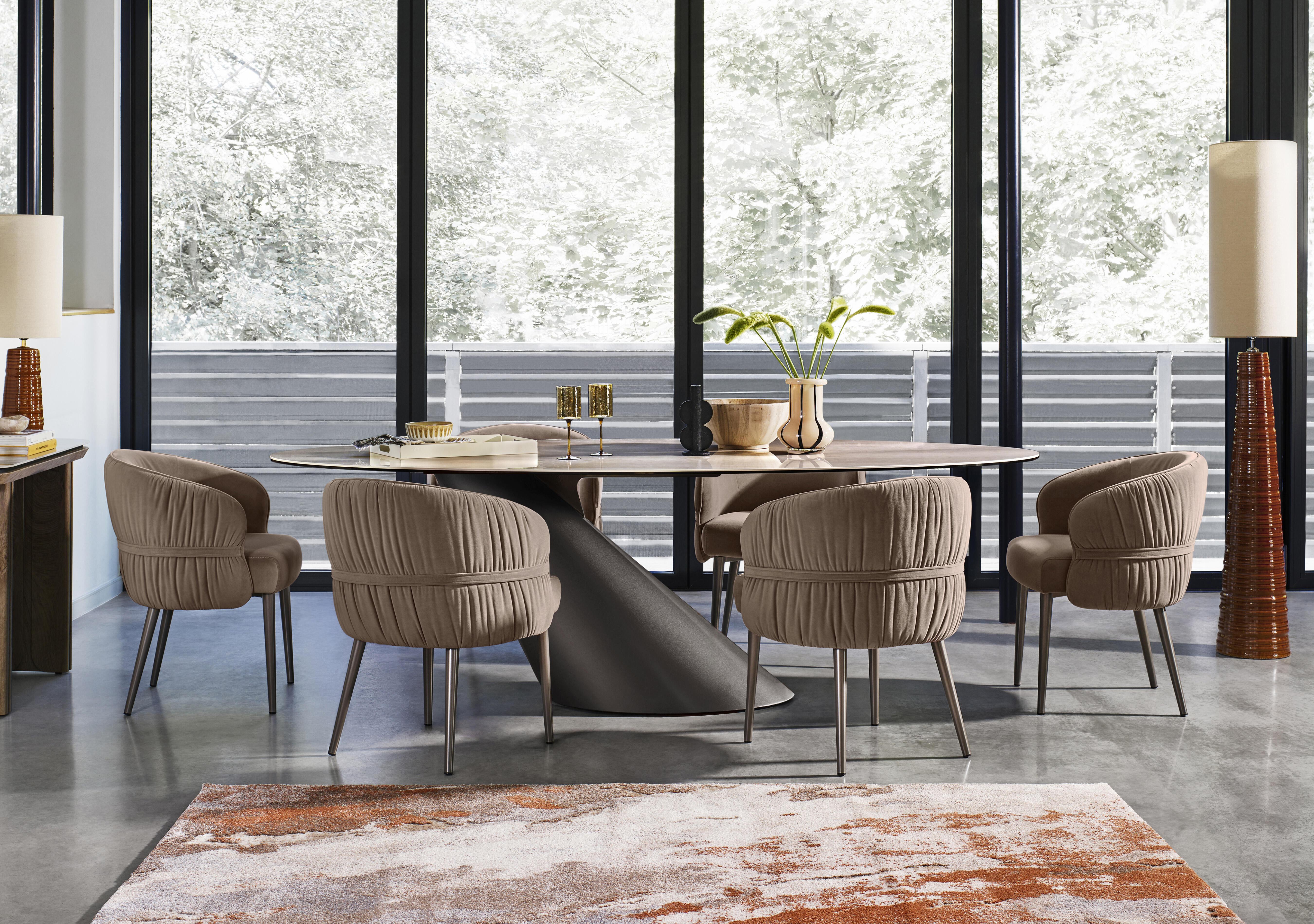Vardy Oval Dining Table and 6 Fabric Dining Chairs in  on Furniture Village