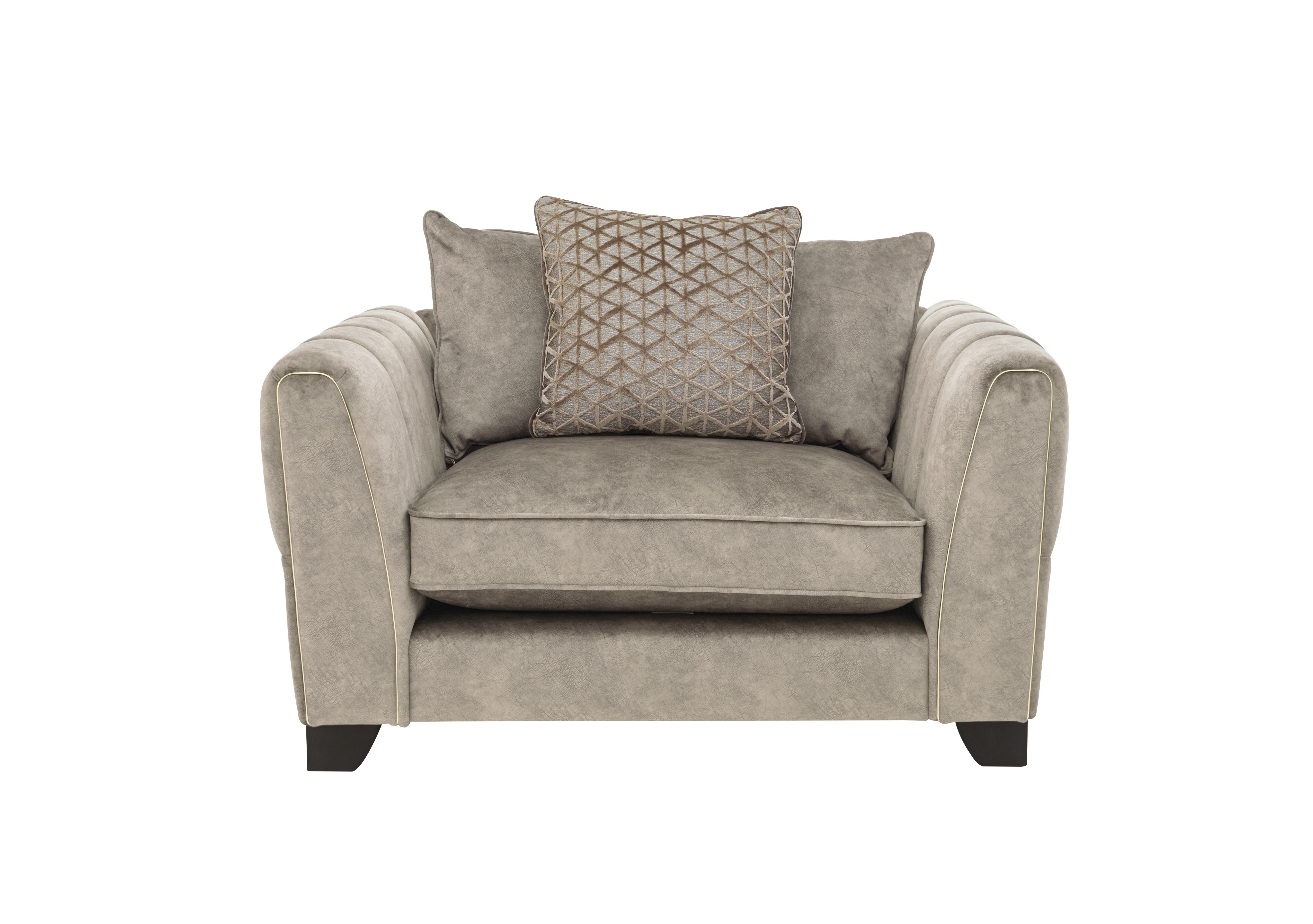 Ariana Pillow Back Fabric Snuggler Chair in Dapple Oyster Brass Insert on Furniture Village