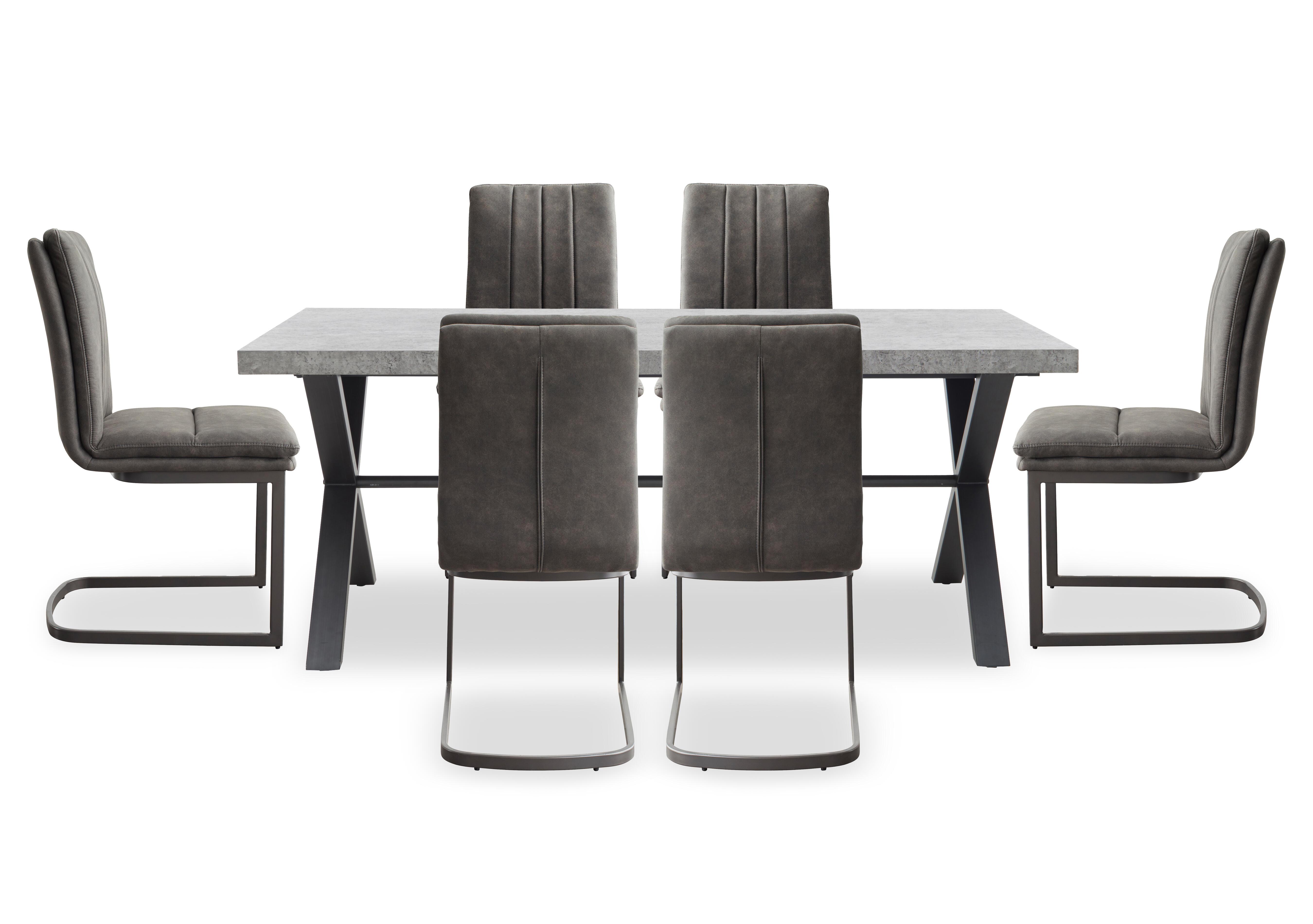 Moon Dining Table with X Shaped Legs and 6 Fabric Cantilever Dining Chairs in  on Furniture Village