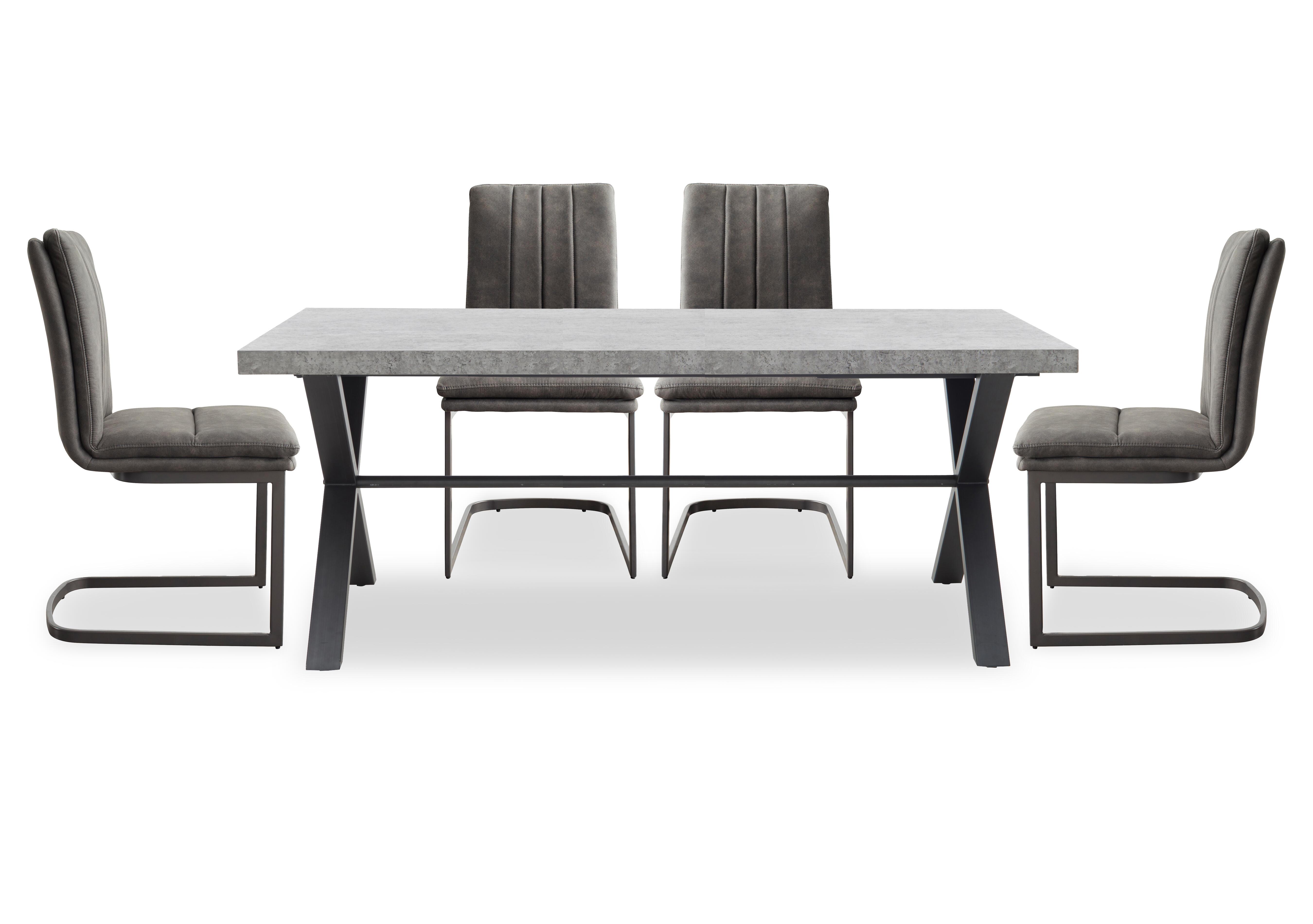Moon Dining Table with X Shaped Legs and 4 Fabric Cantilever Dining Chairs in  on Furniture Village