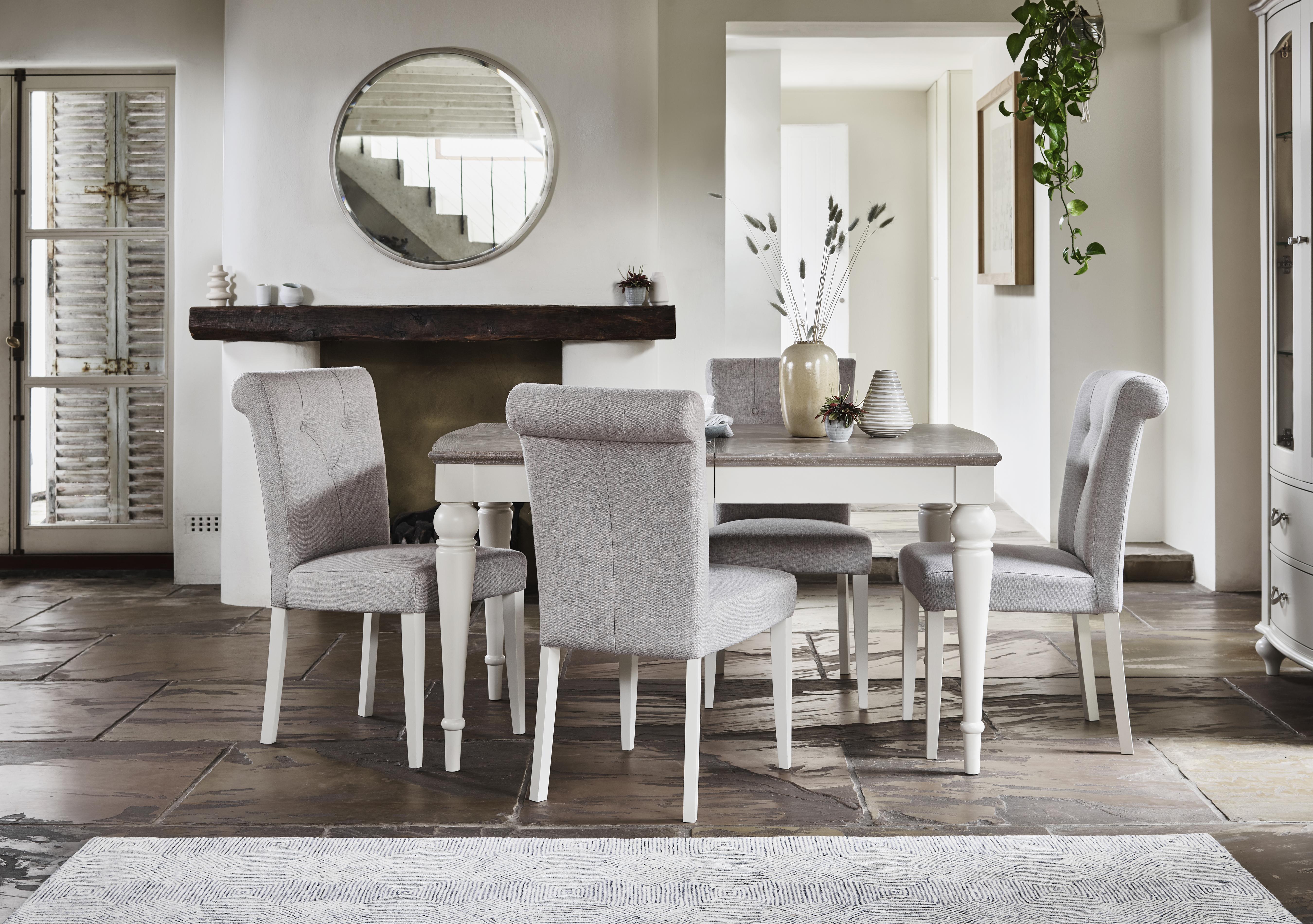 Annecy Extending Dining Table and 4 Upholstered Fabric Roll Back Chairs in  on Furniture Village