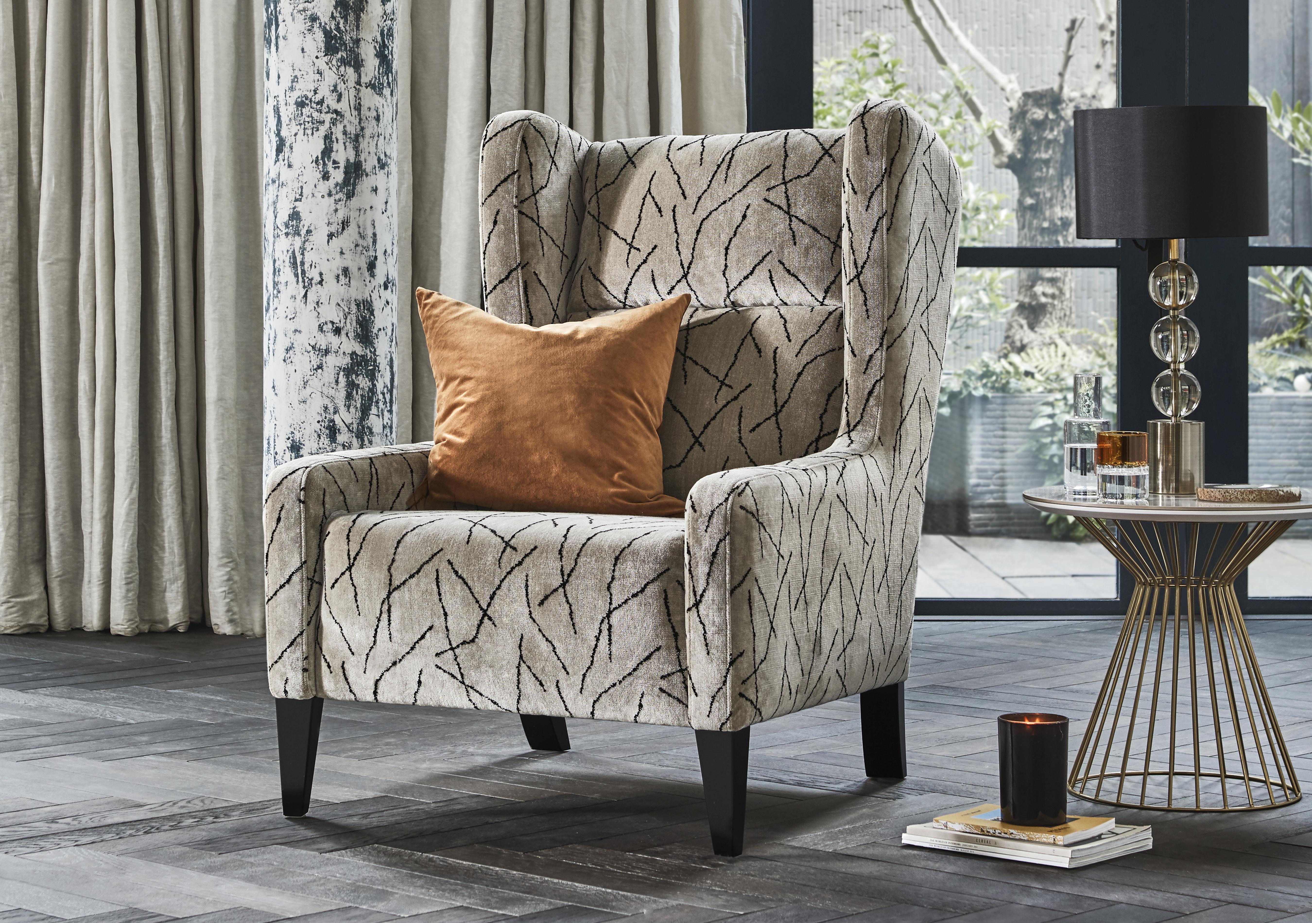 Boutique Lavish Fabric Wing Chair in  on Furniture Village