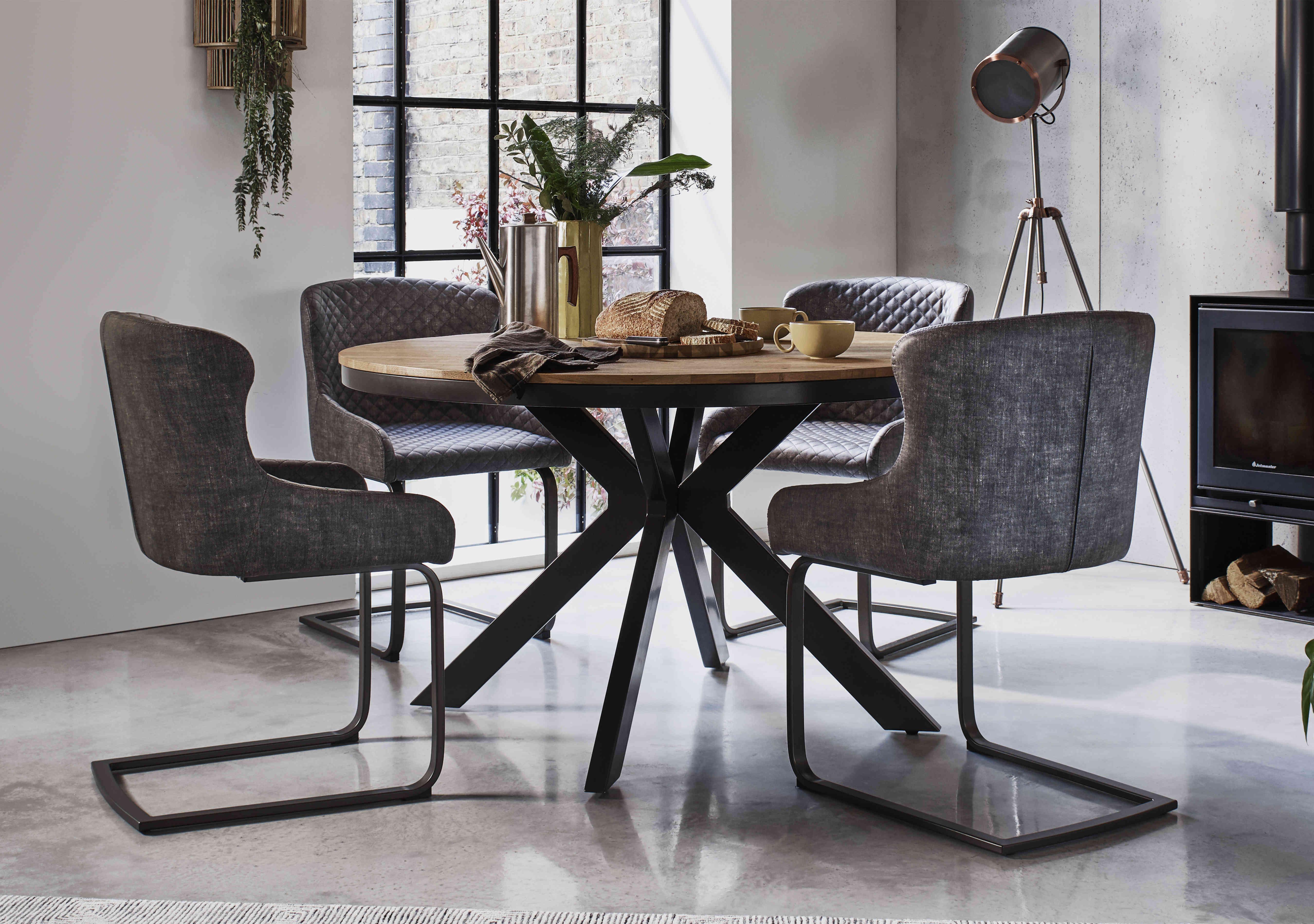 Earth Round Dining Table with 4 Cantilever Dining Chairs in  on Furniture Village