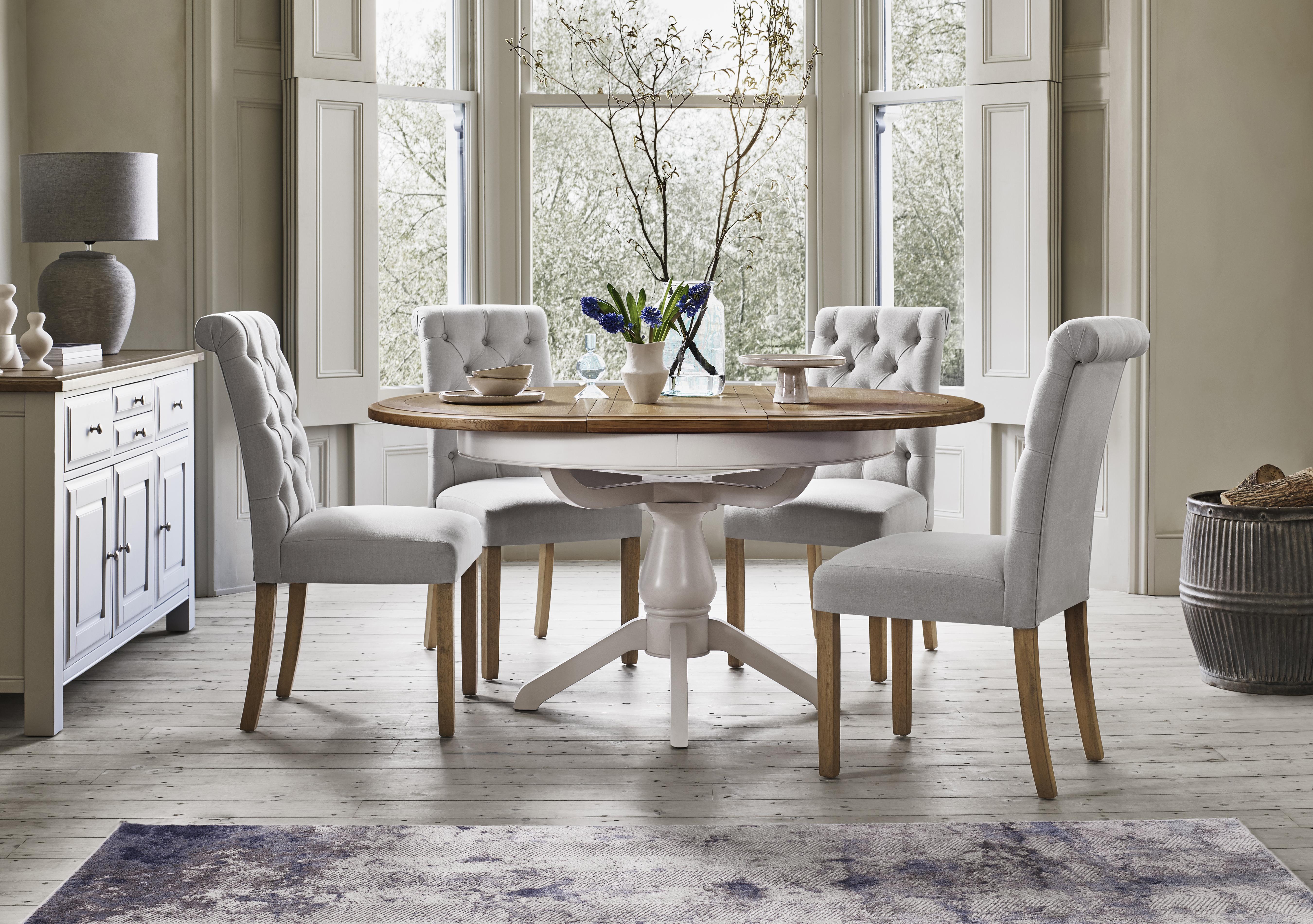 Hamilton Round Extending Dining Table and 4 Button Back Dining Chairs in  on Furniture Village