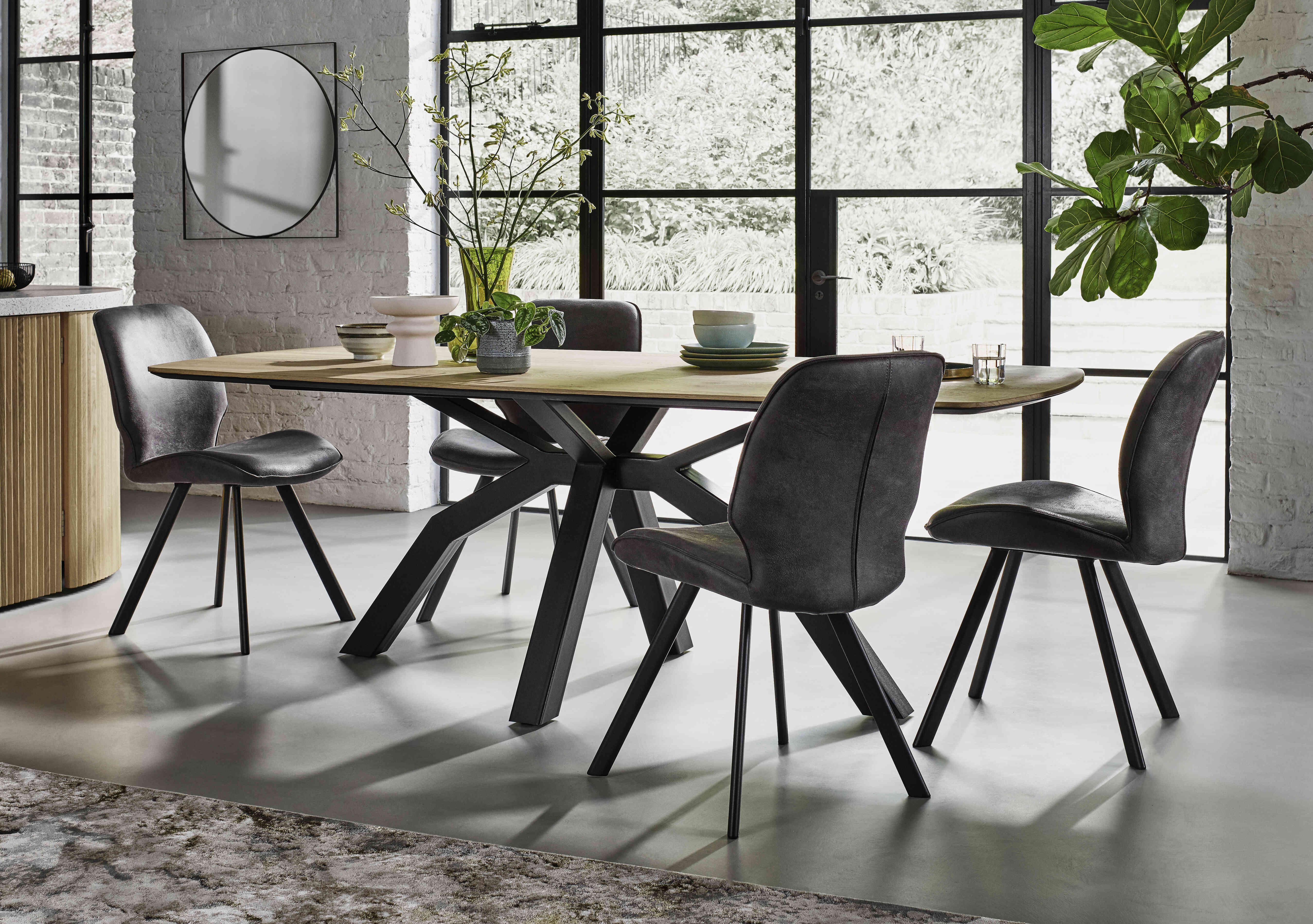 Montreal Dining Table with Spider Legs and 4 Semmi Chairs in  on Furniture Village