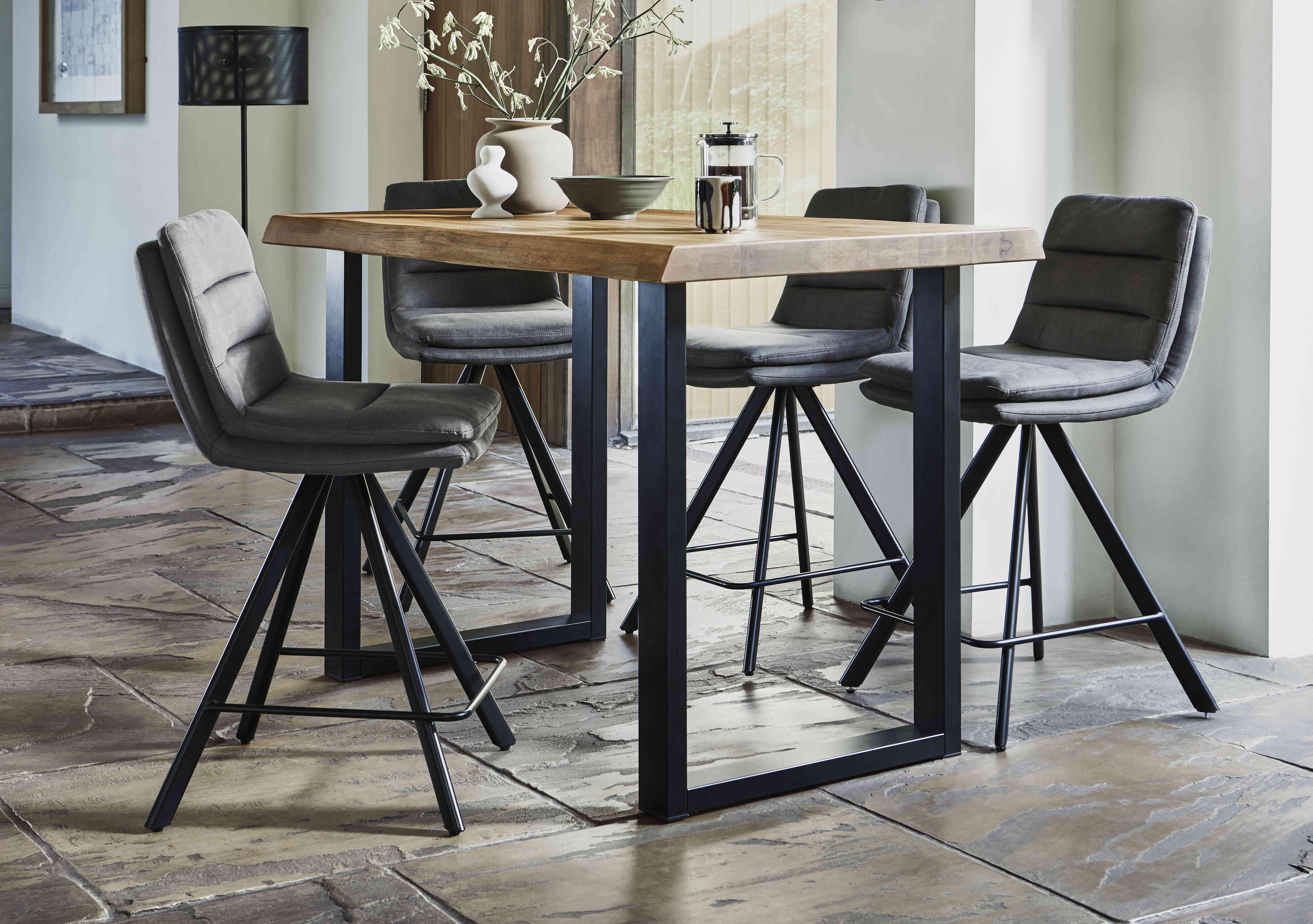 Compact Terra Raw Edge Bar Table with U-Shaped Legs and 4 Njord Bar Stools in  on Furniture Village