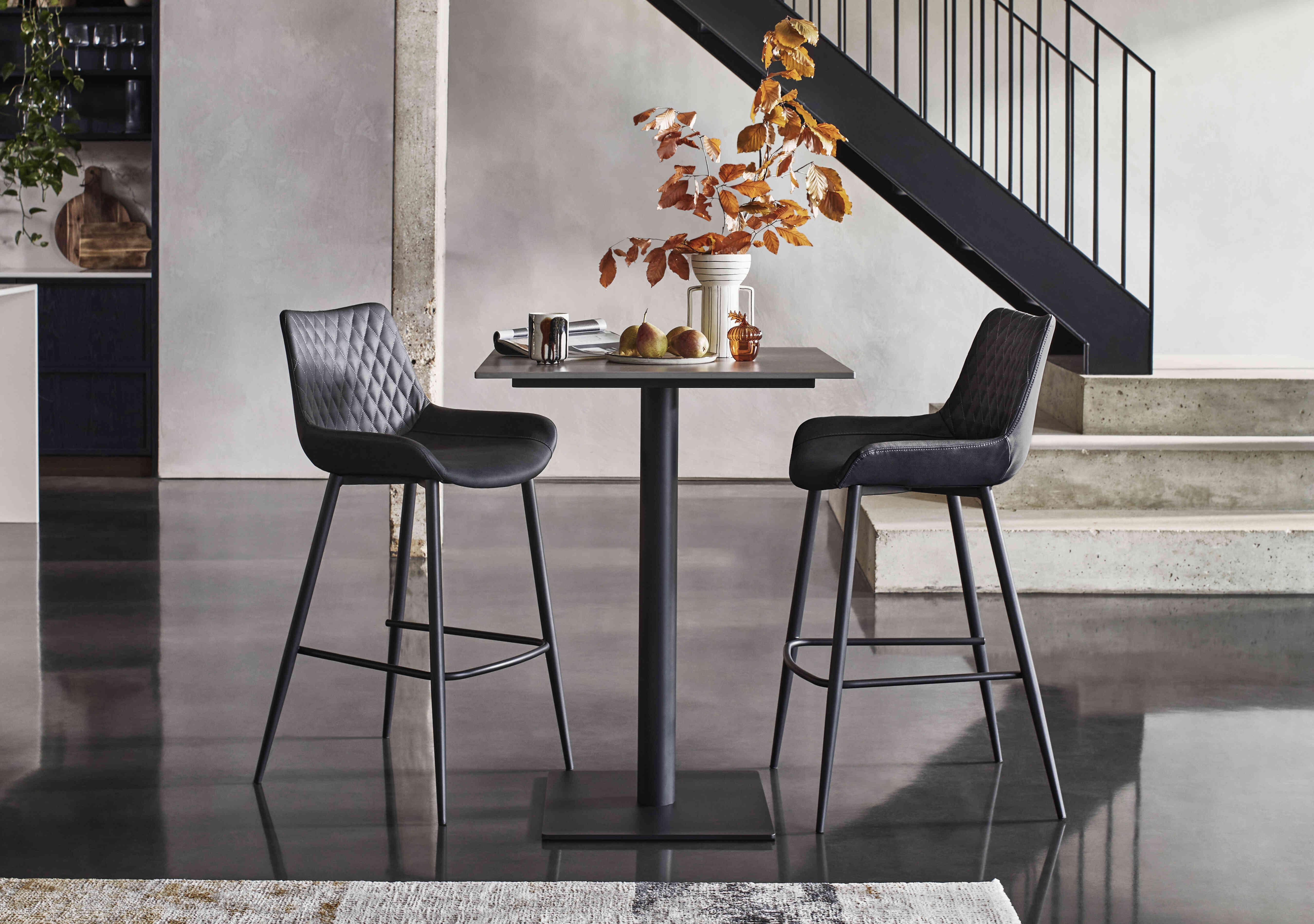 Ion Bar Table with 2 Faux Leather Bar Stools in  on Furniture Village