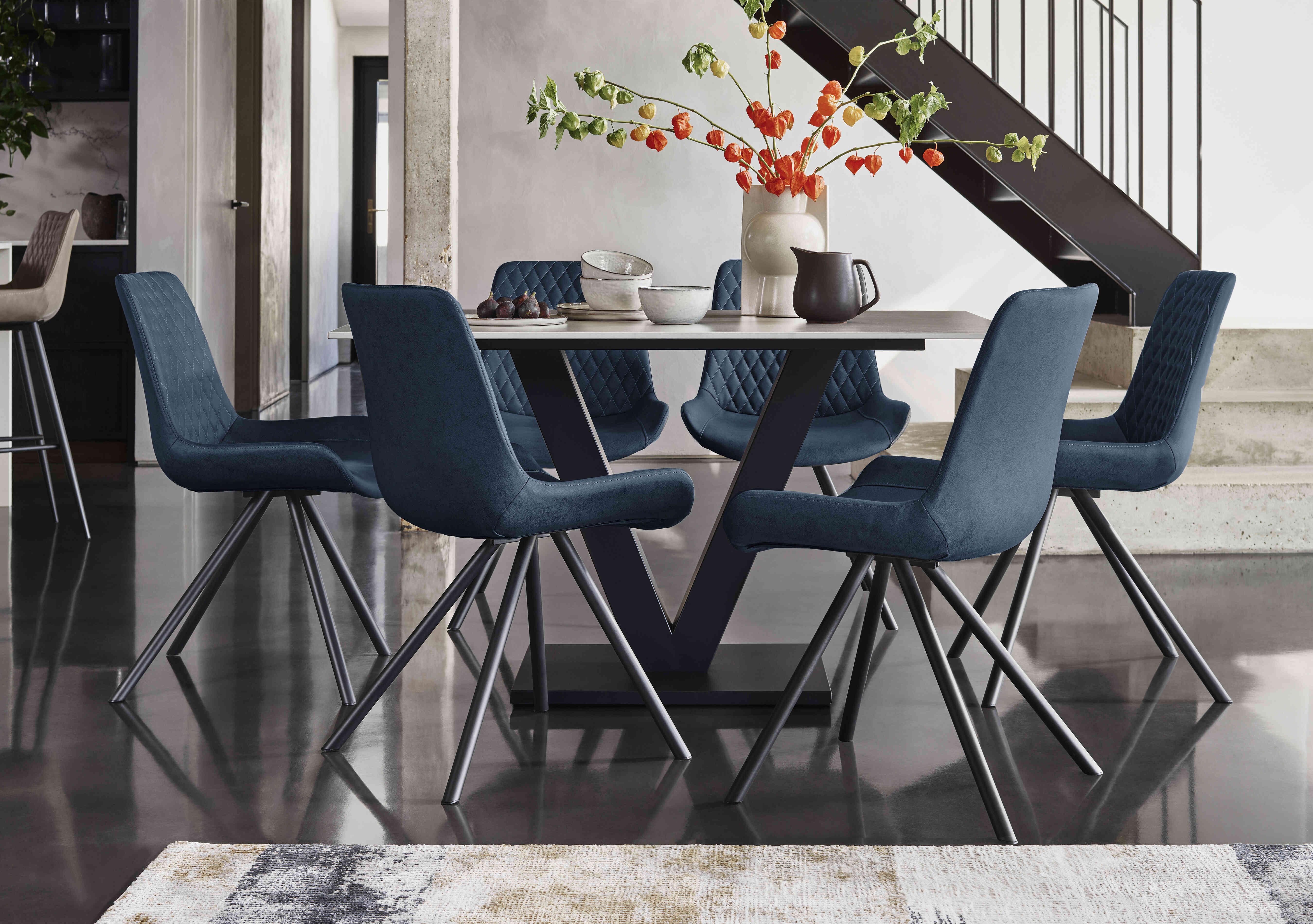 Ion Fixed Dining Table with 6 Fabric Dining Chairs in  on Furniture Village