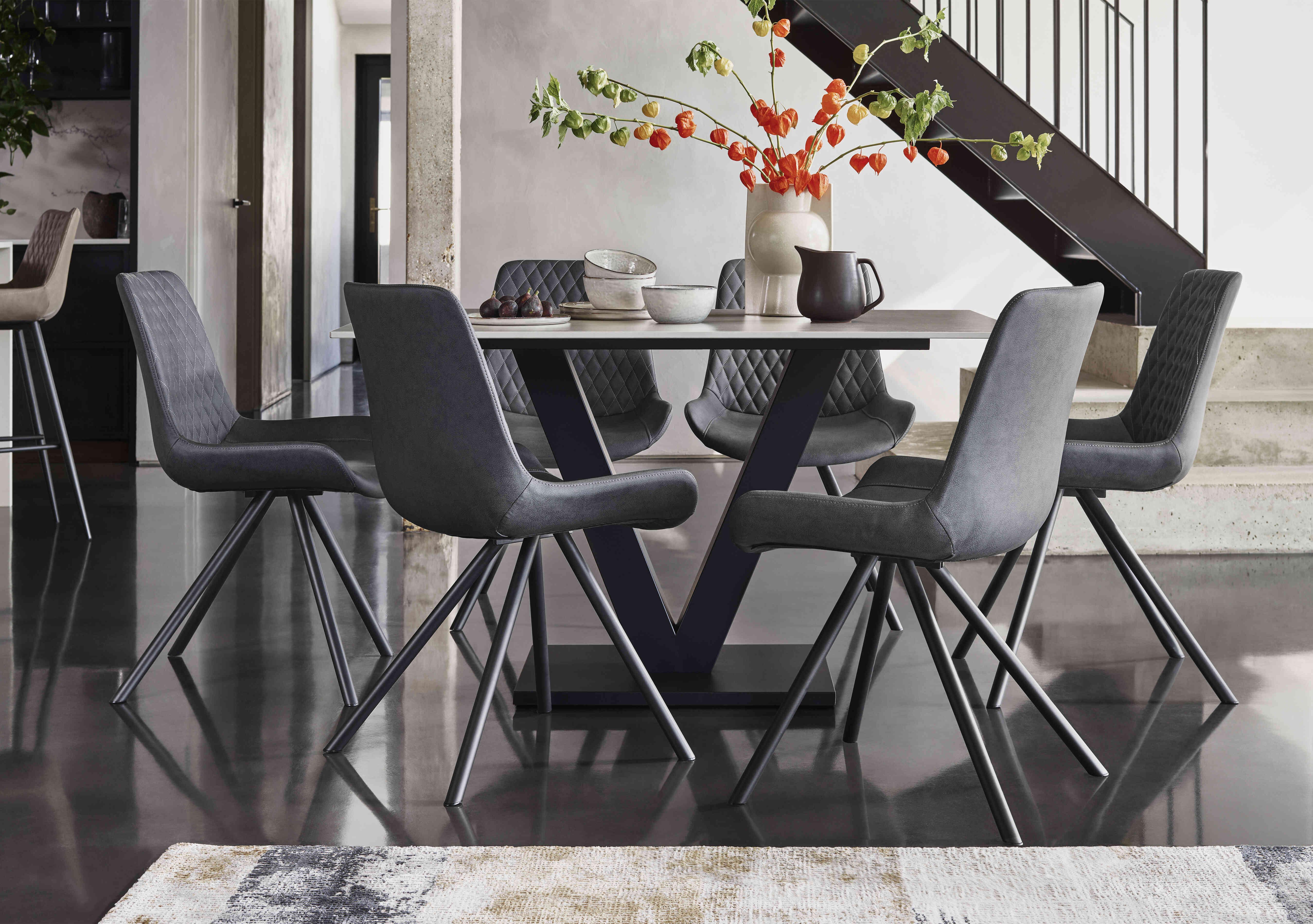 Ion Fixed Dining Table with 6 Faux Leather Chairs in  on Furniture Village