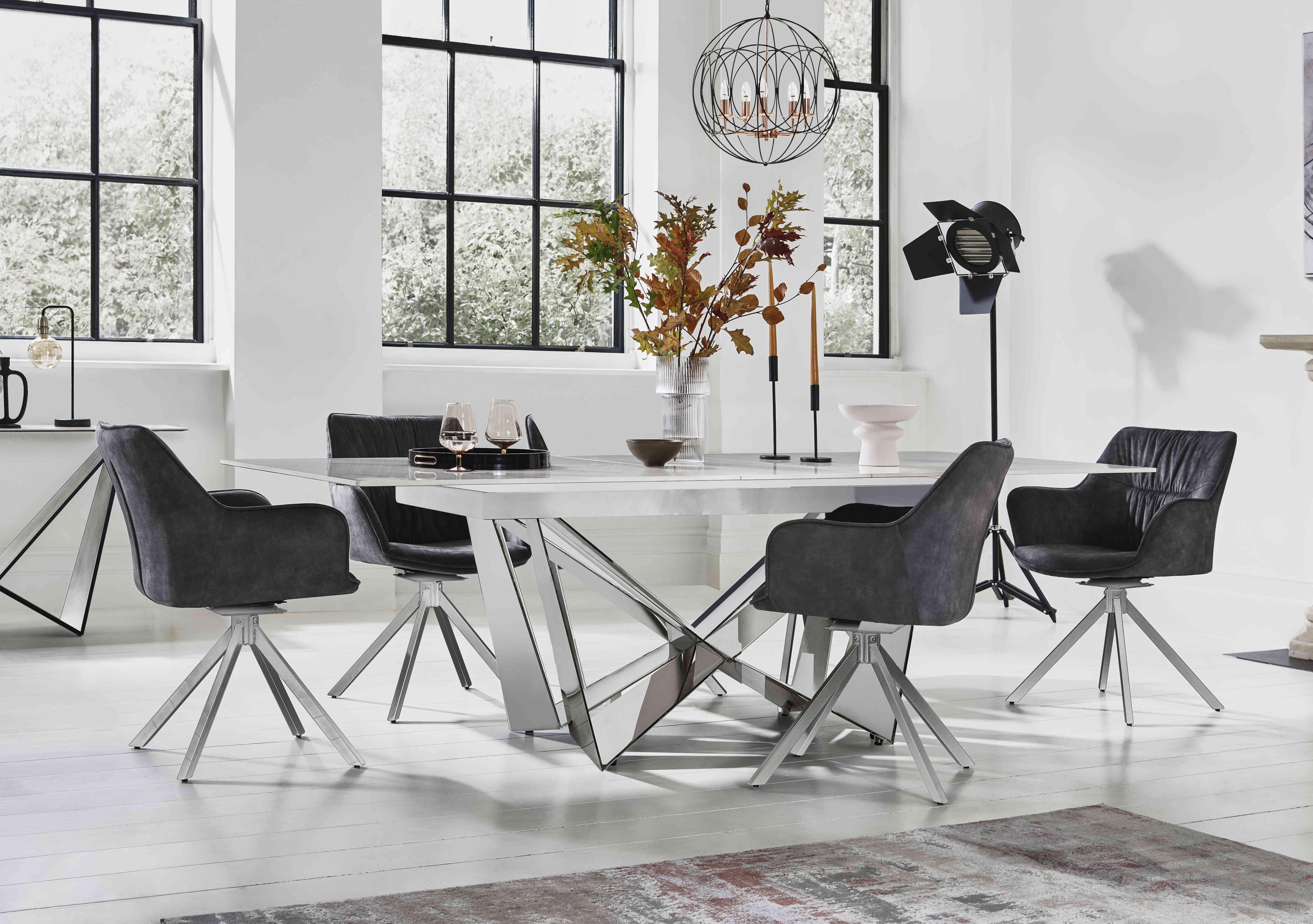 Marvel Chrome Small Extending Dining Table and 4 Swivel Dining Chairs in  on Furniture Village