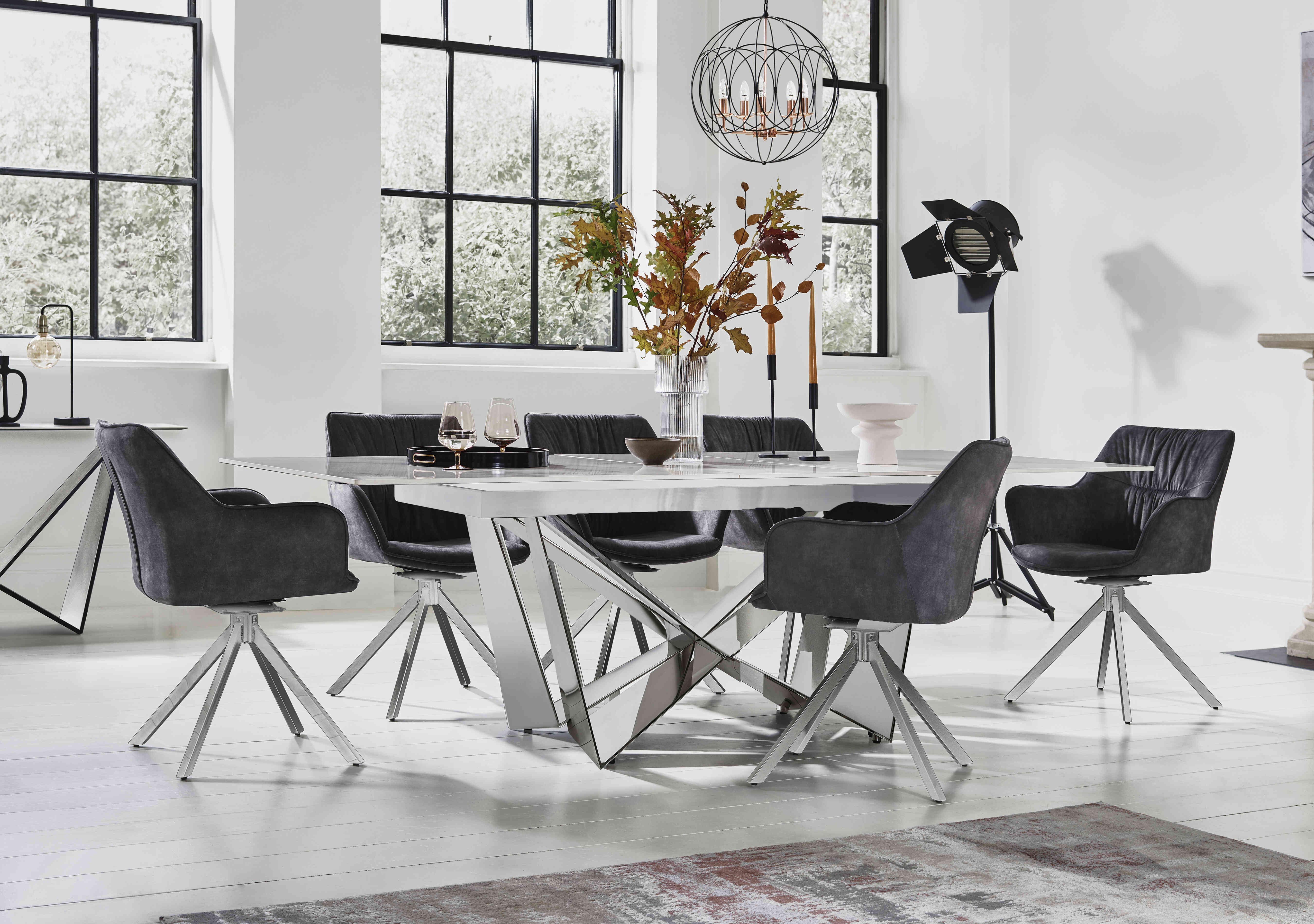 Marvel Chrome Small Extending Dining Table and 6 Swivel Dining Chairs in  on Furniture Village