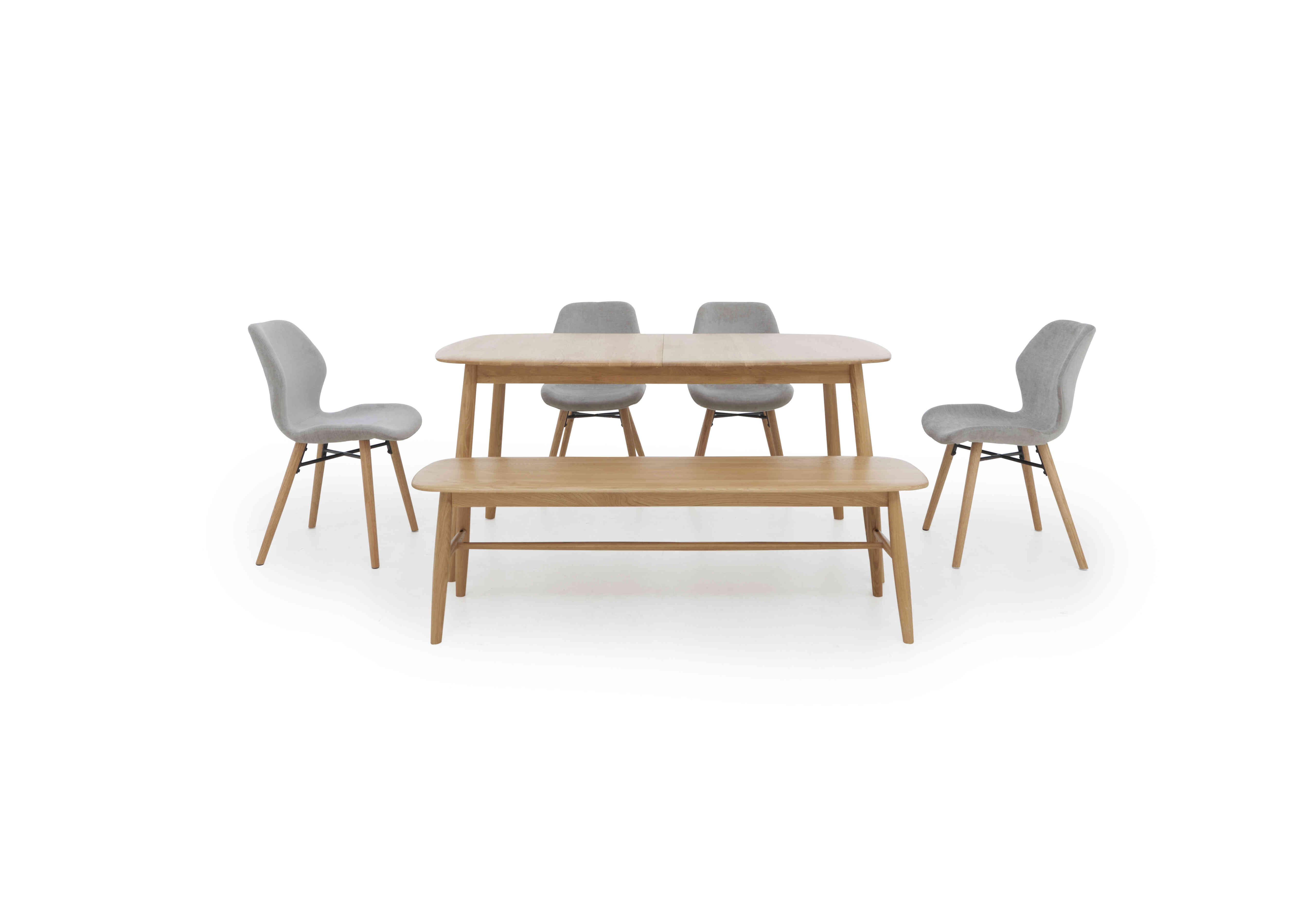 Stockholm Extending Dining Table with 4 Upholstered Dining Chairs and a Dining Bench in Light Oak on Furniture Village