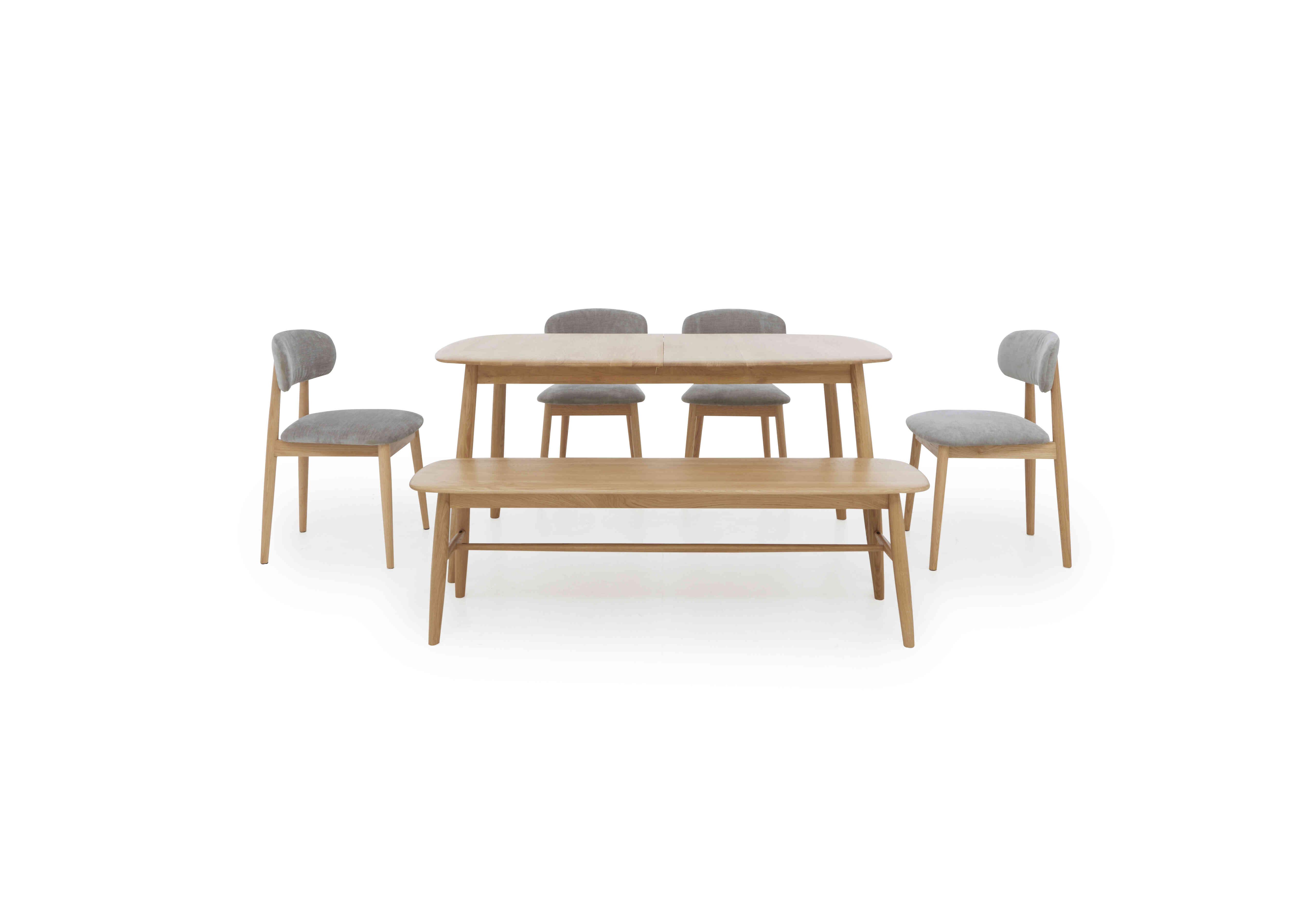 Stockholm Extending Dining Table with 4 Wooden Dining Chairs and a Dining Bench in Light Oak on Furniture Village
