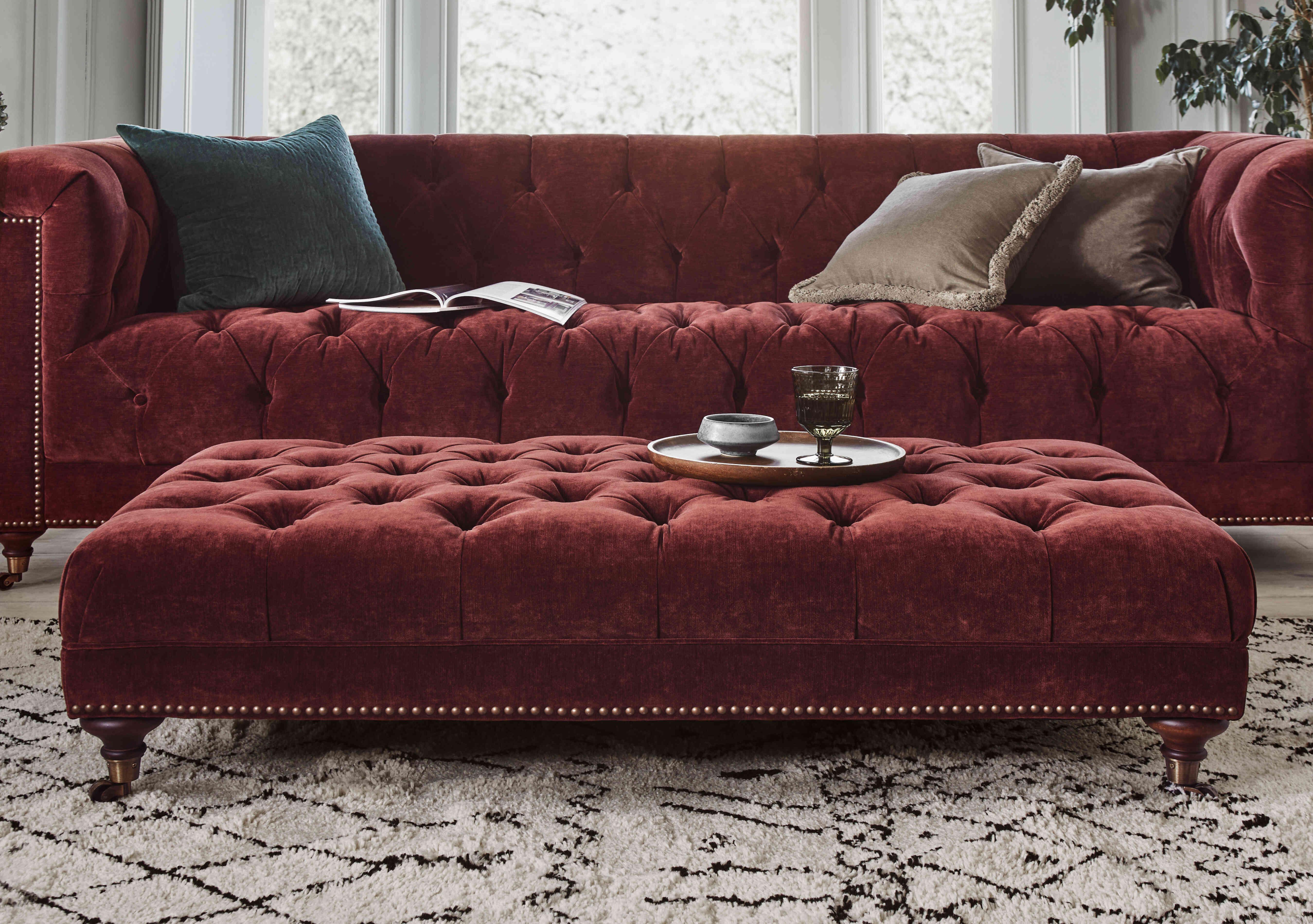 Wallace Fabric Rectangular Footstool with Castors in  on Furniture Village