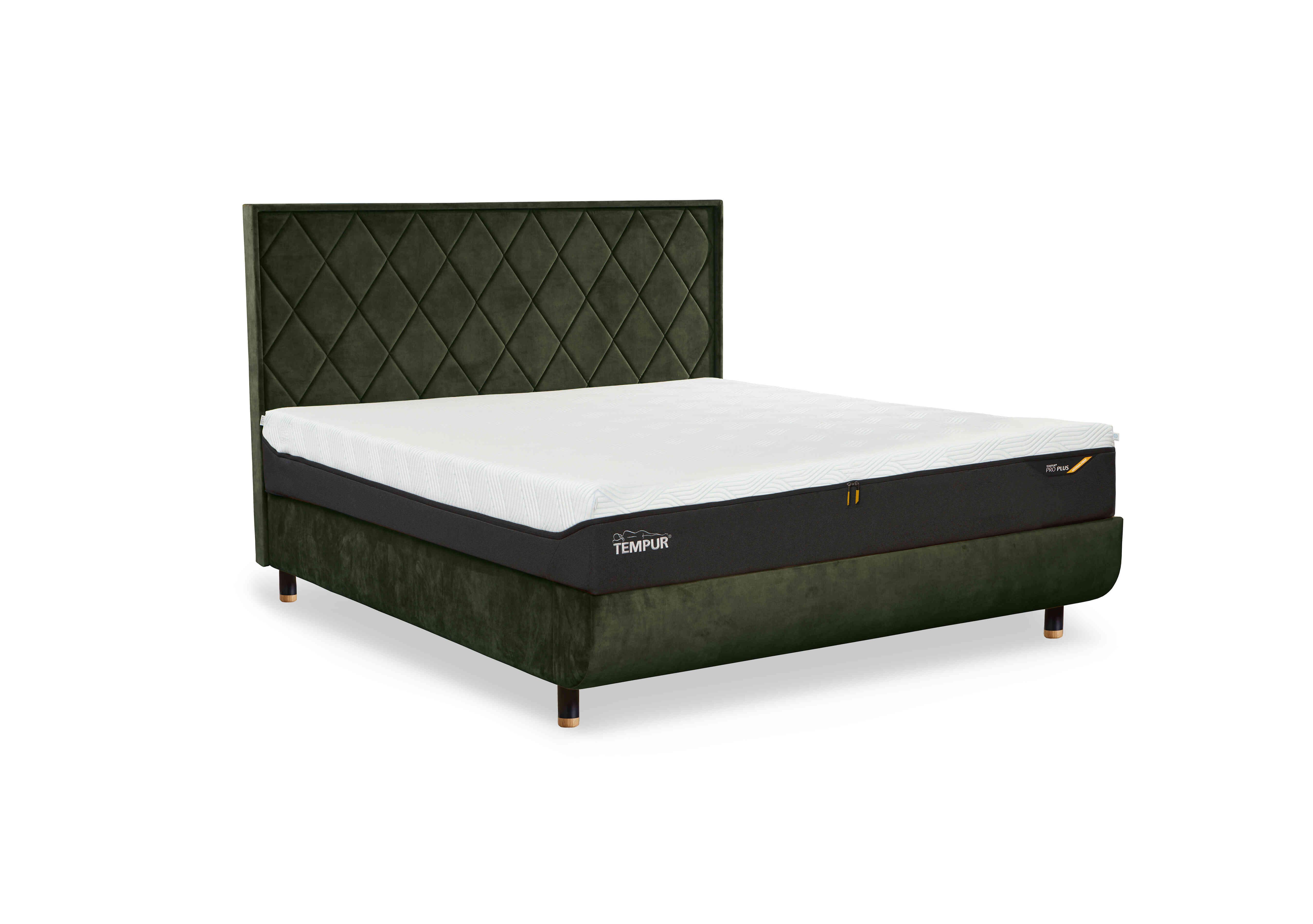 Arc Disc Ottoman Bed Frame with Quilted Headboard in Dark Green-Black/Oak Feet on Furniture Village