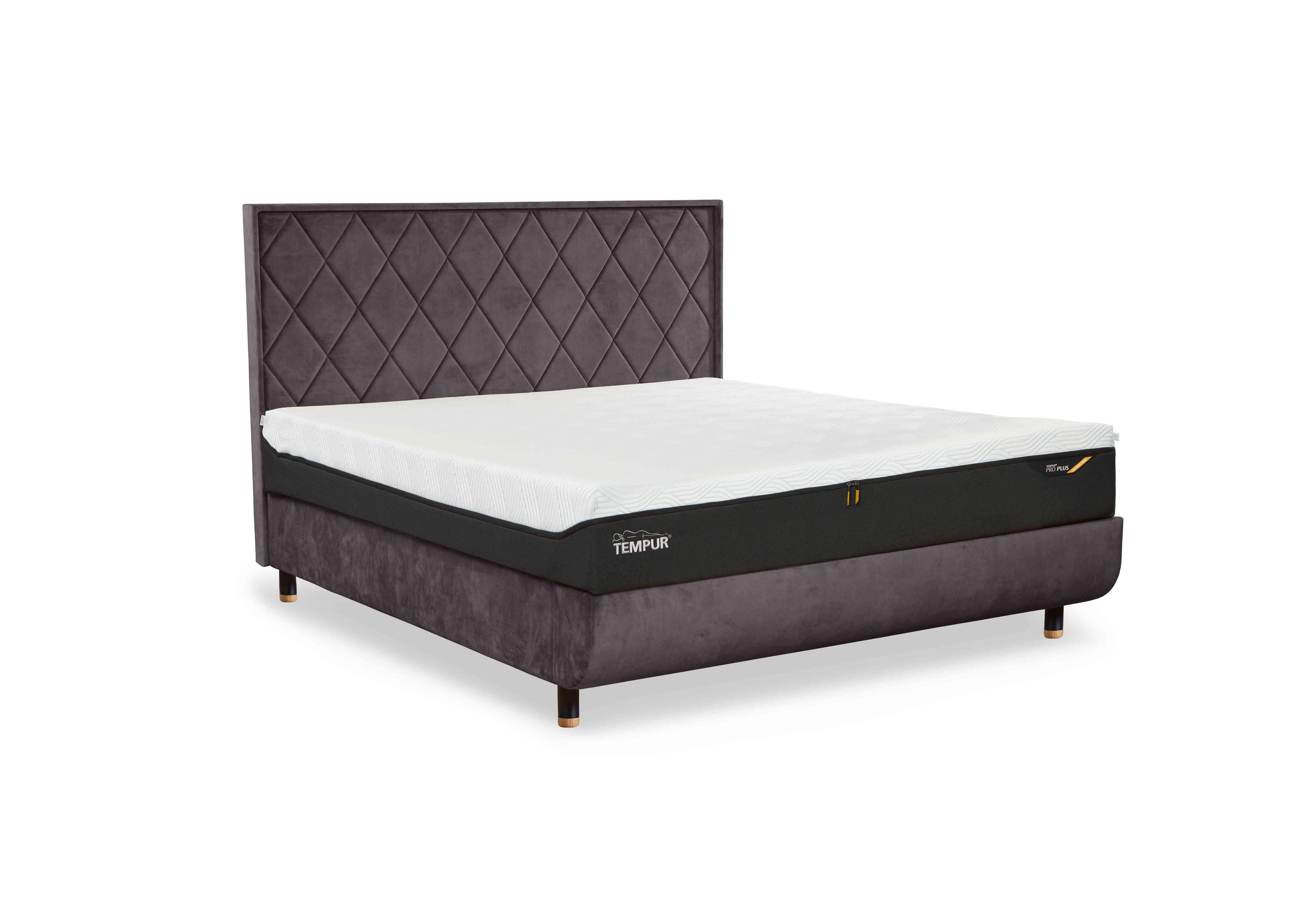 Arc Disc Ottoman Bed Frame with Quilted Headboard in Dark Stone-Black/Oak Feet on Furniture Village