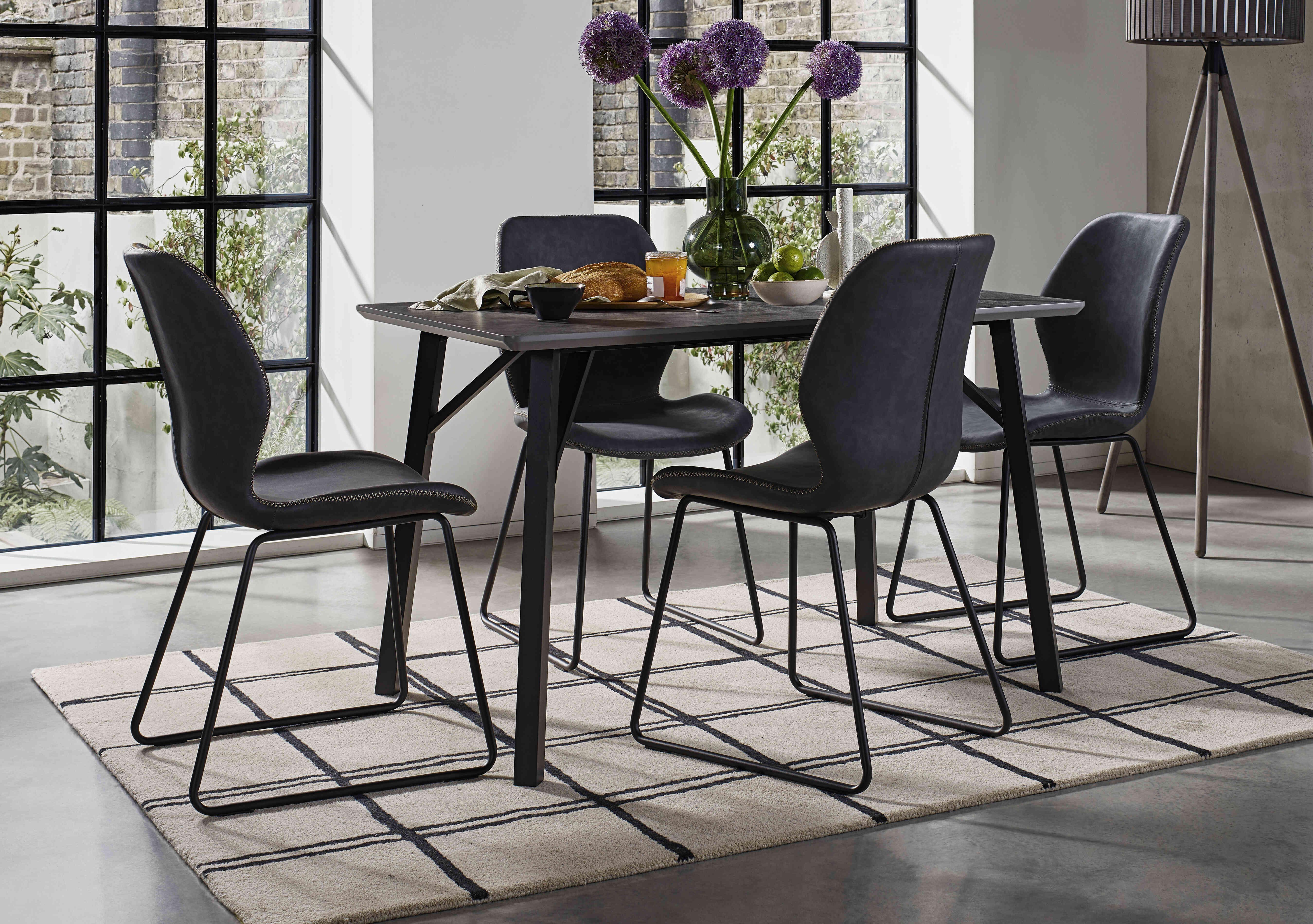 Matteo Rectangular Dining Table with 4 Faux Leather Ski Leg Chairs in  on Furniture Village
