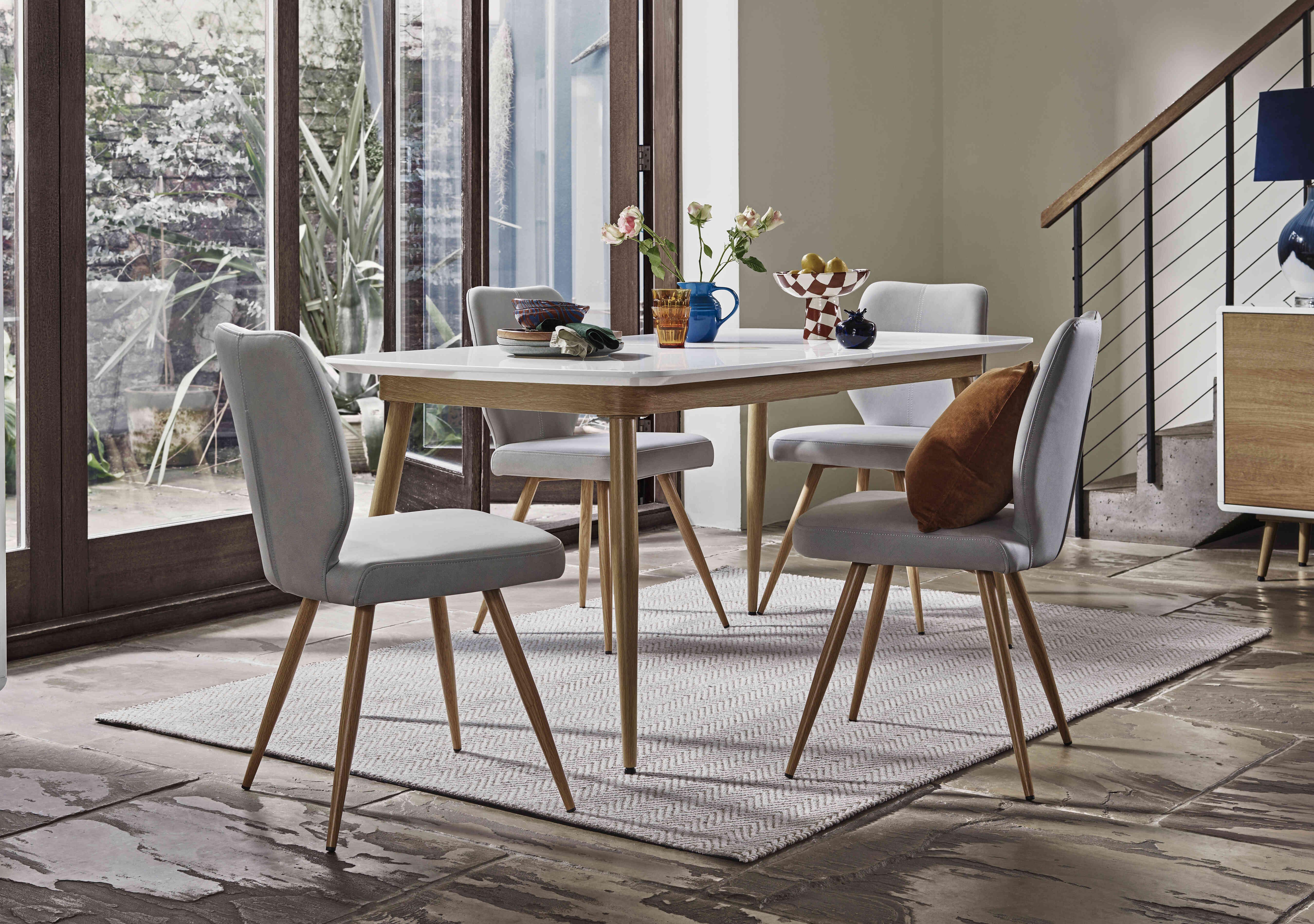 Jonah Extending Dining Table with 4 Faux Leather Dining Chairs in  on Furniture Village