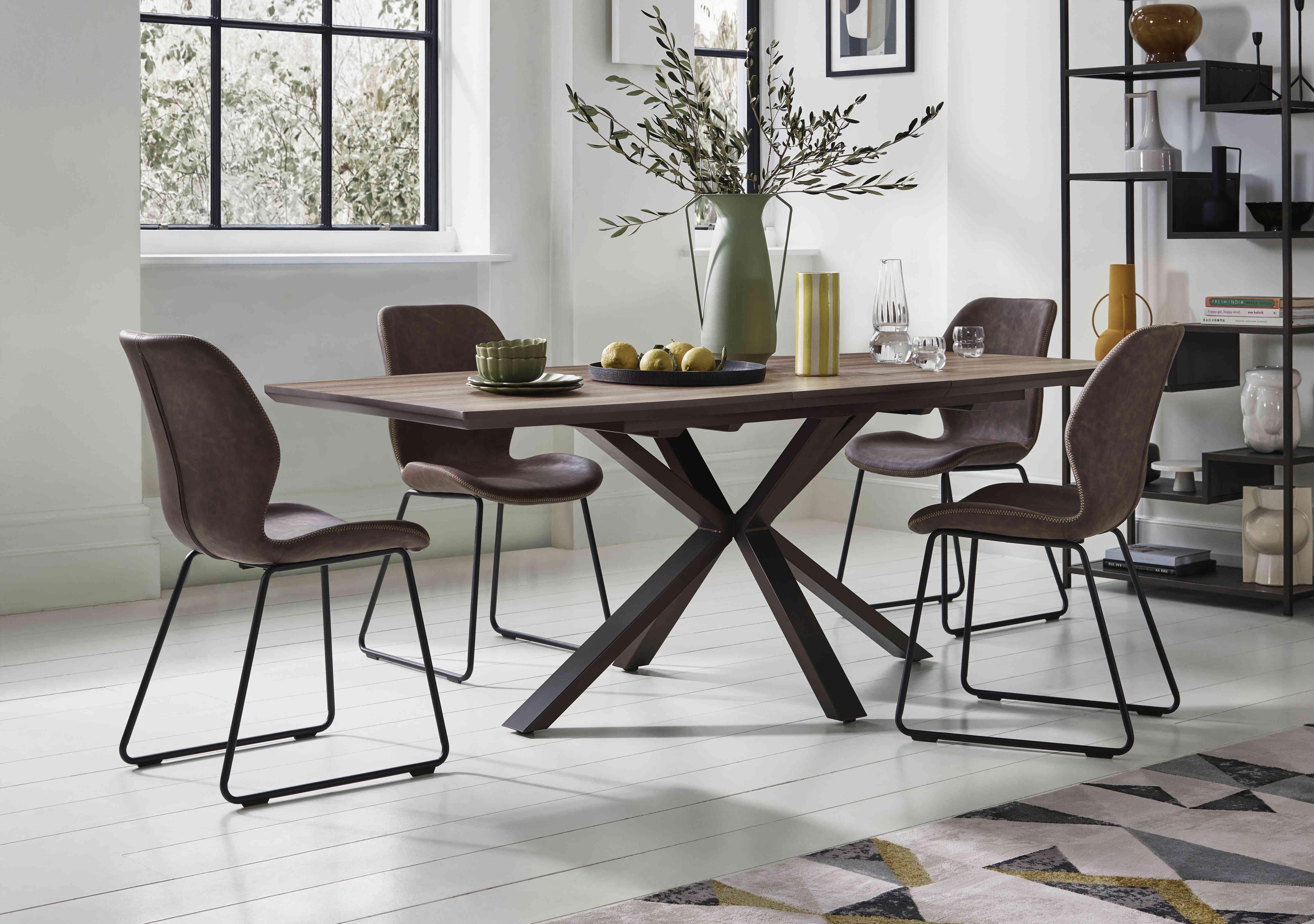 Pedro Extending Dining Table with 4 Faux Leather Ski Leg Dining Chairs in  on Furniture Village