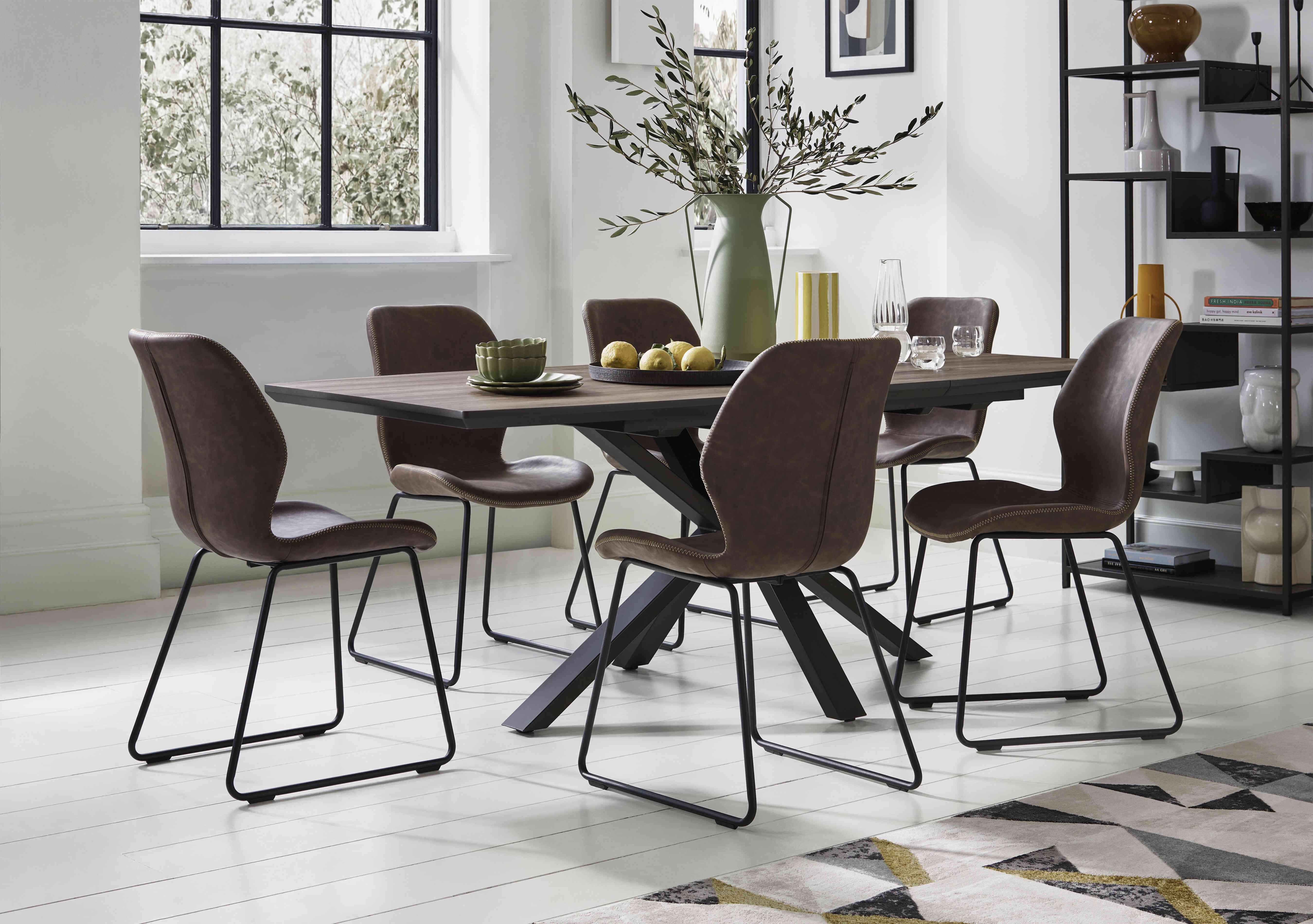 Pedro Extending Dining Table with 6 Faux Leather Ski Leg Dining Chairs in  on Furniture Village