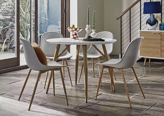 Jonah Round Dining Table with 4 Trellis Plastic Dining Chairs Furniture Village