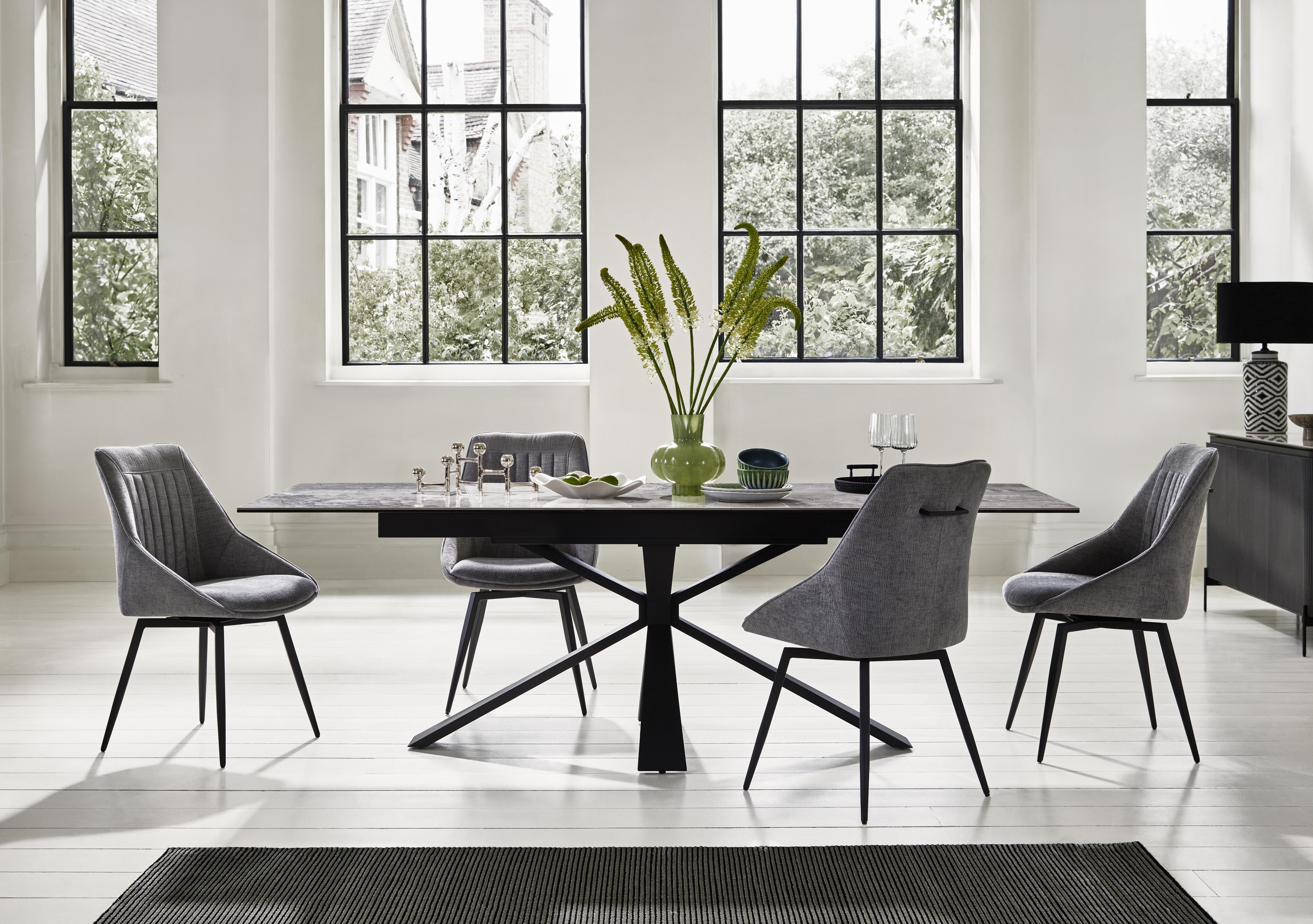Crete Large Extending Dining Table and 4 Swivel Dining Chairs in  on Furniture Village