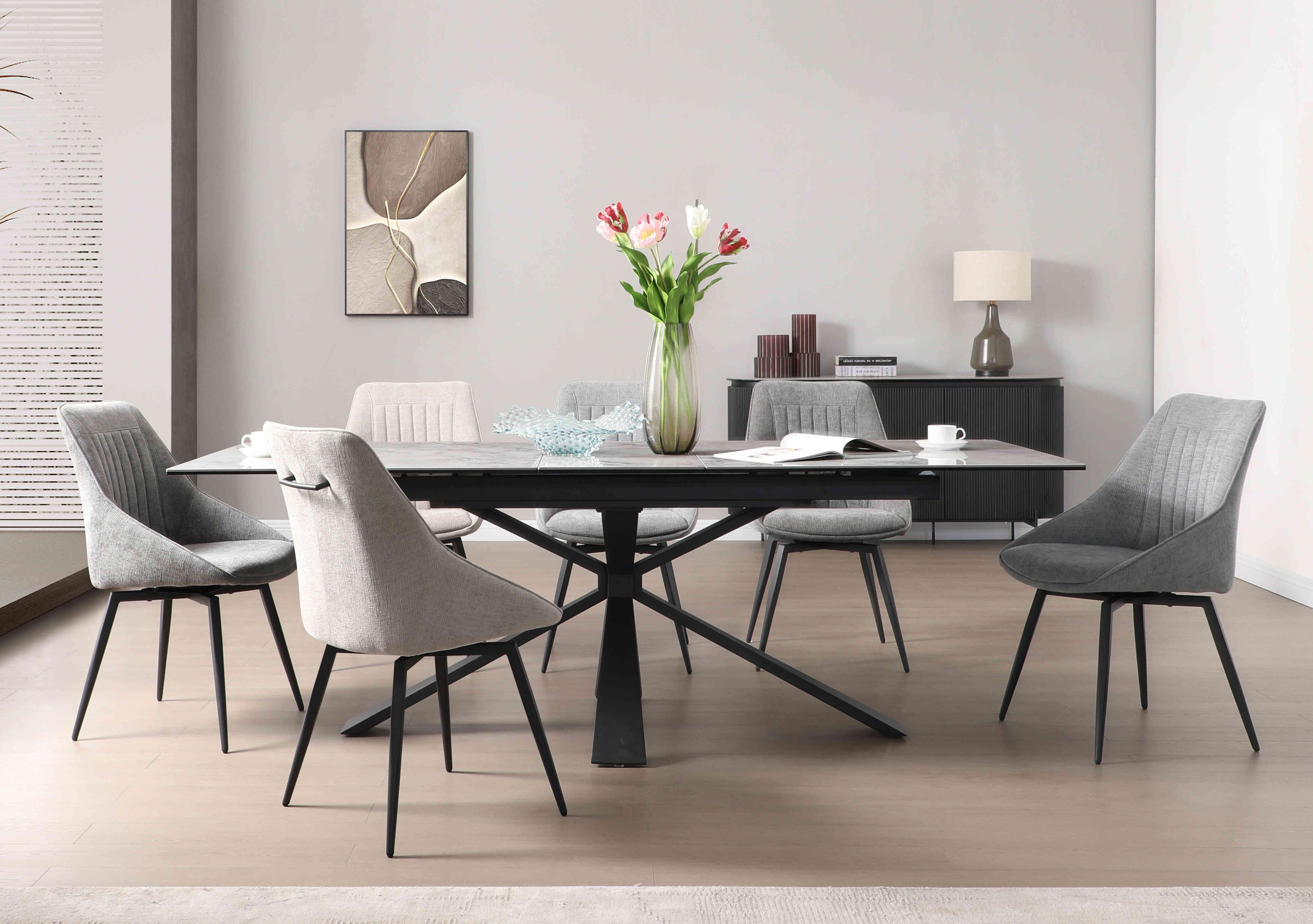 Crete Large Extending Dining Table and 6 Swivel Dining Chairs in  on Furniture Village