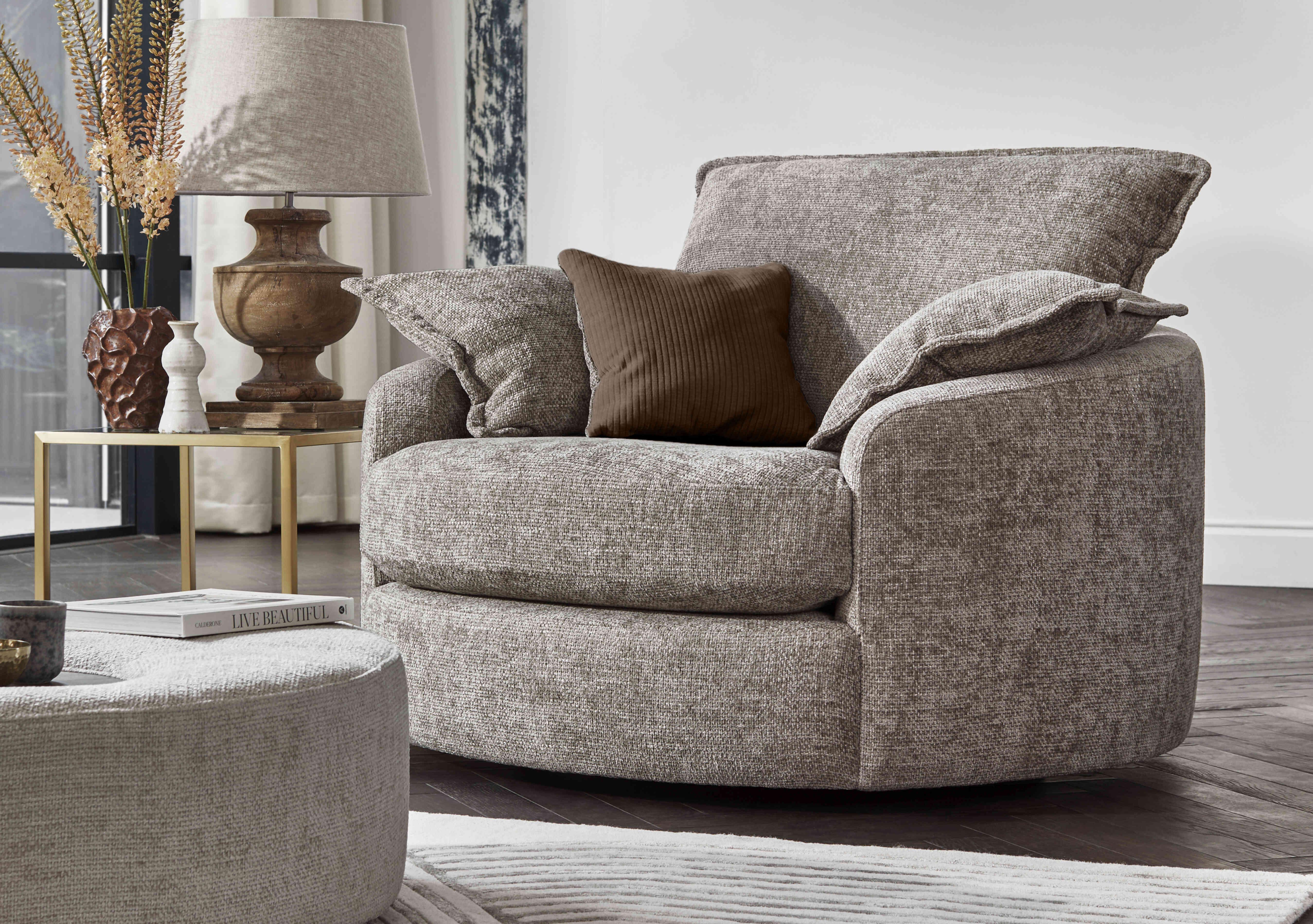 Boutique Darling Swivel Cuddler Chair in  on Furniture Village