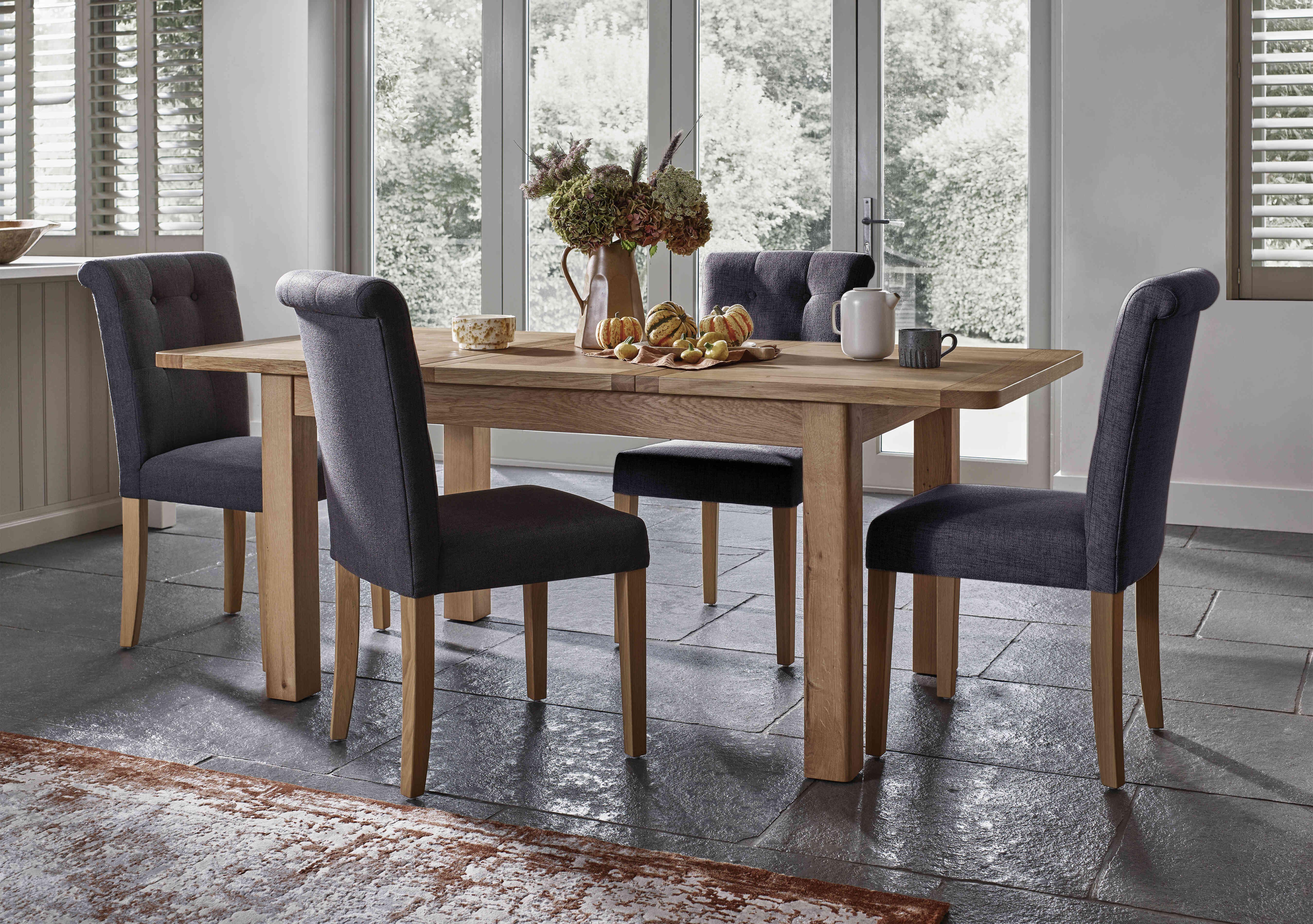 Augusta Small Rectangular Extending Dining Table and 4 Roll Back Upholstered Dining Chairs in  on Furniture Village