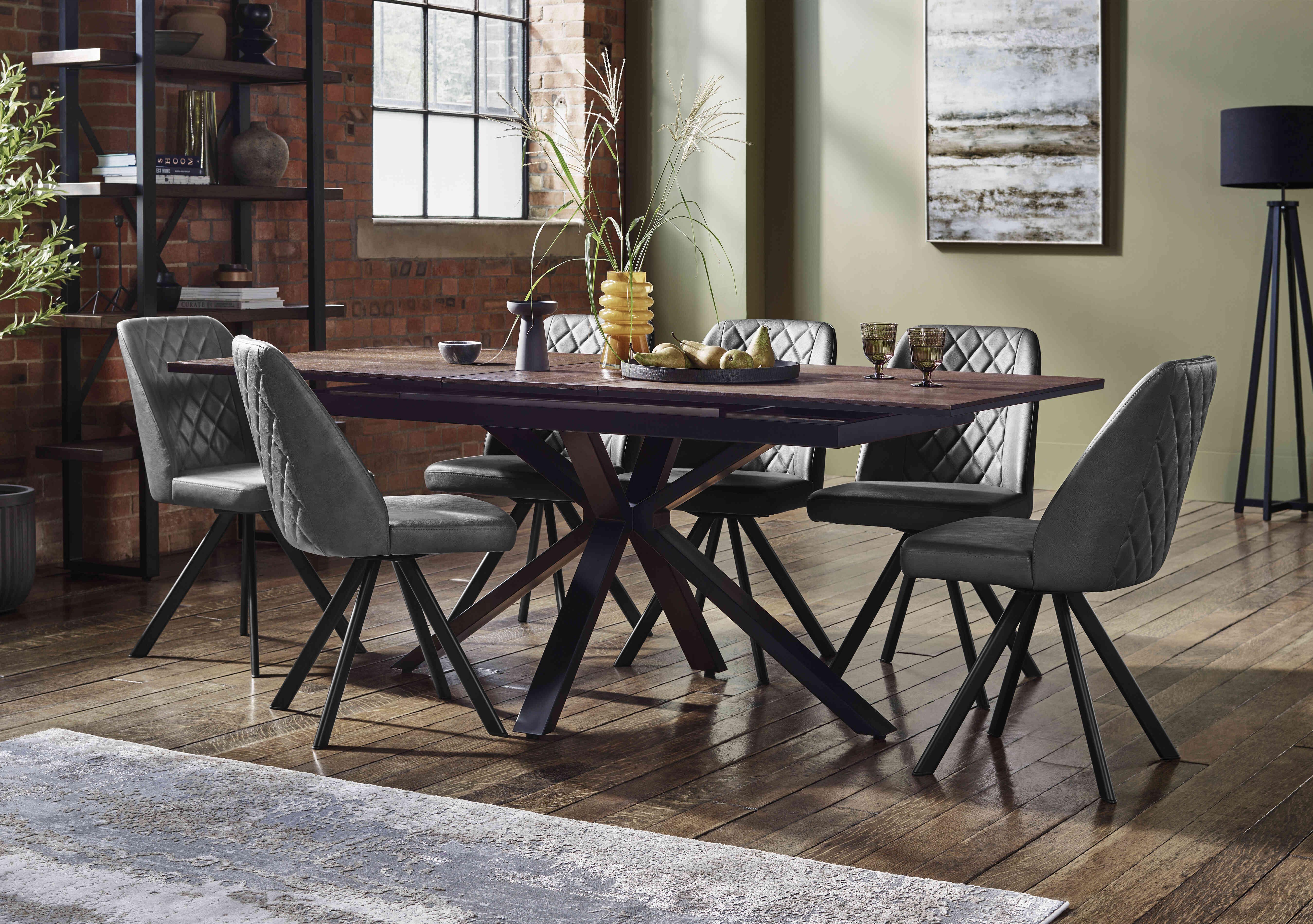 Mars Pop-up Dining Table with 6 Faux Leather Swivel Dining Chairs in  on Furniture Village