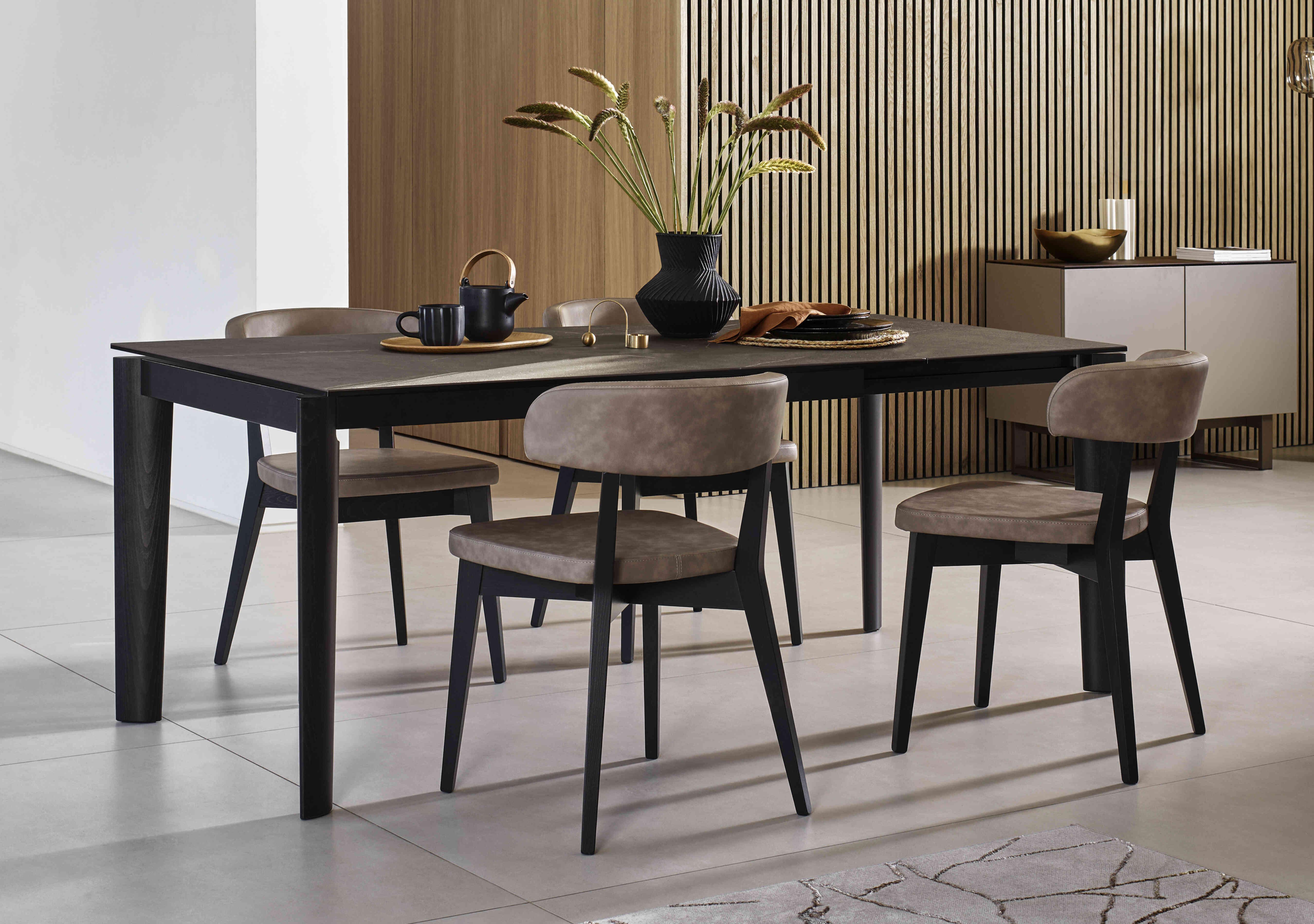 Rosa 130cm Small Extending Dining Table with Bronze Ceramic Top and Graphite Wooden Legs and 4 Siren Dining Chairs in  on Furniture Village