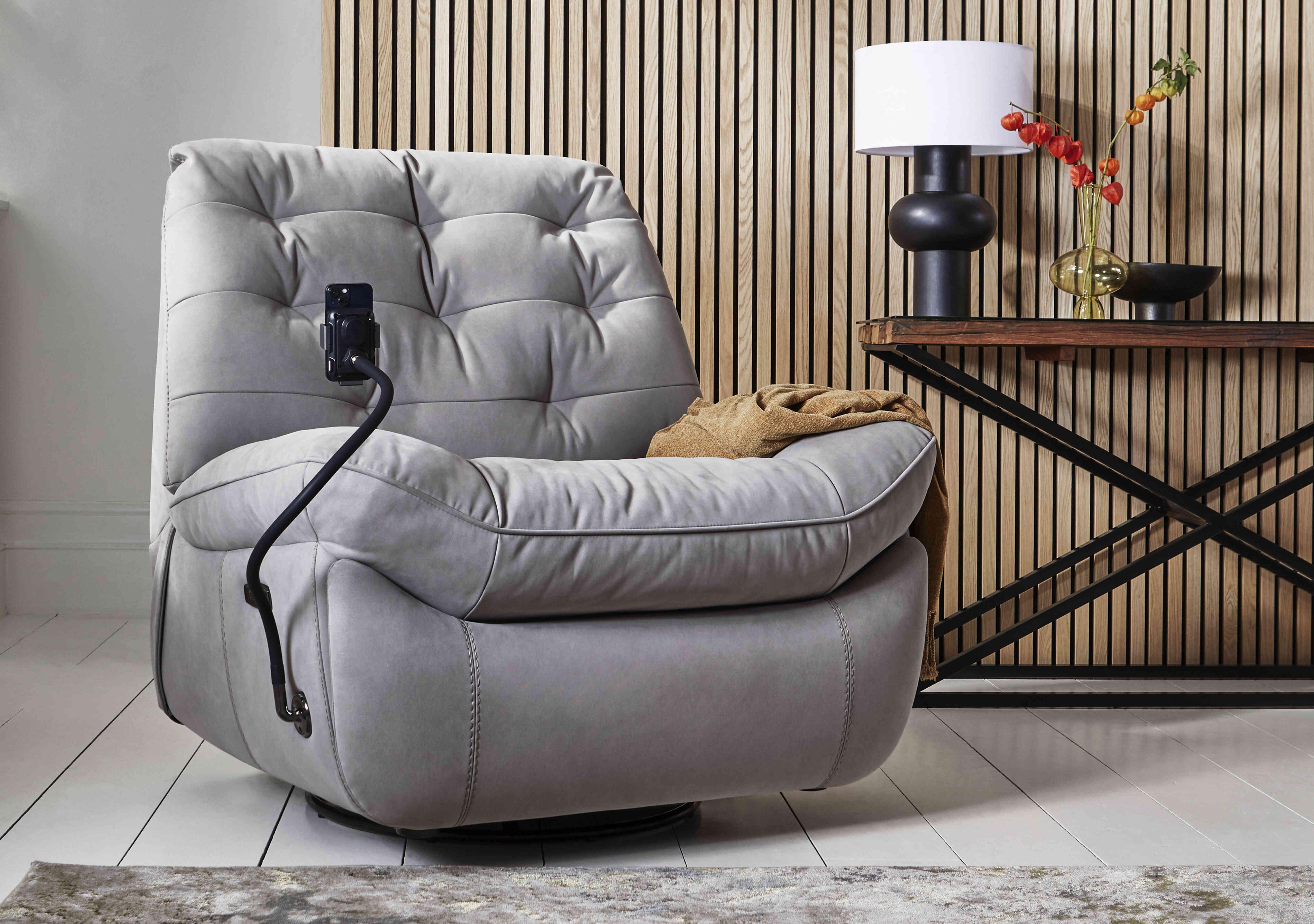 Ozzy Fabric Swivel Power Recliner Chair with Phone Holder in  on Furniture Village