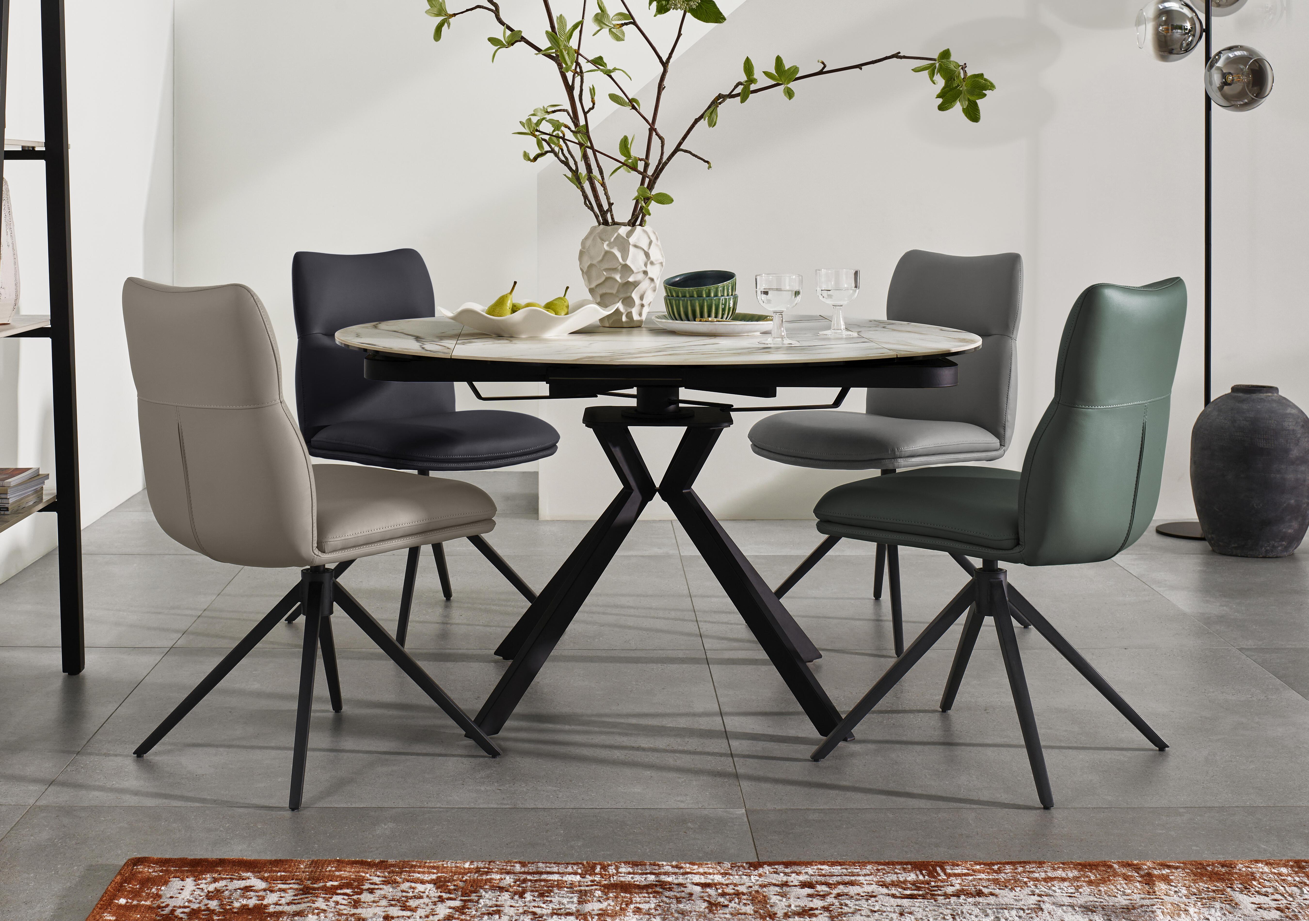 Quattro Extending Swivel Dining Table and 4 Swivel Dining Chairs in  on Furniture Village