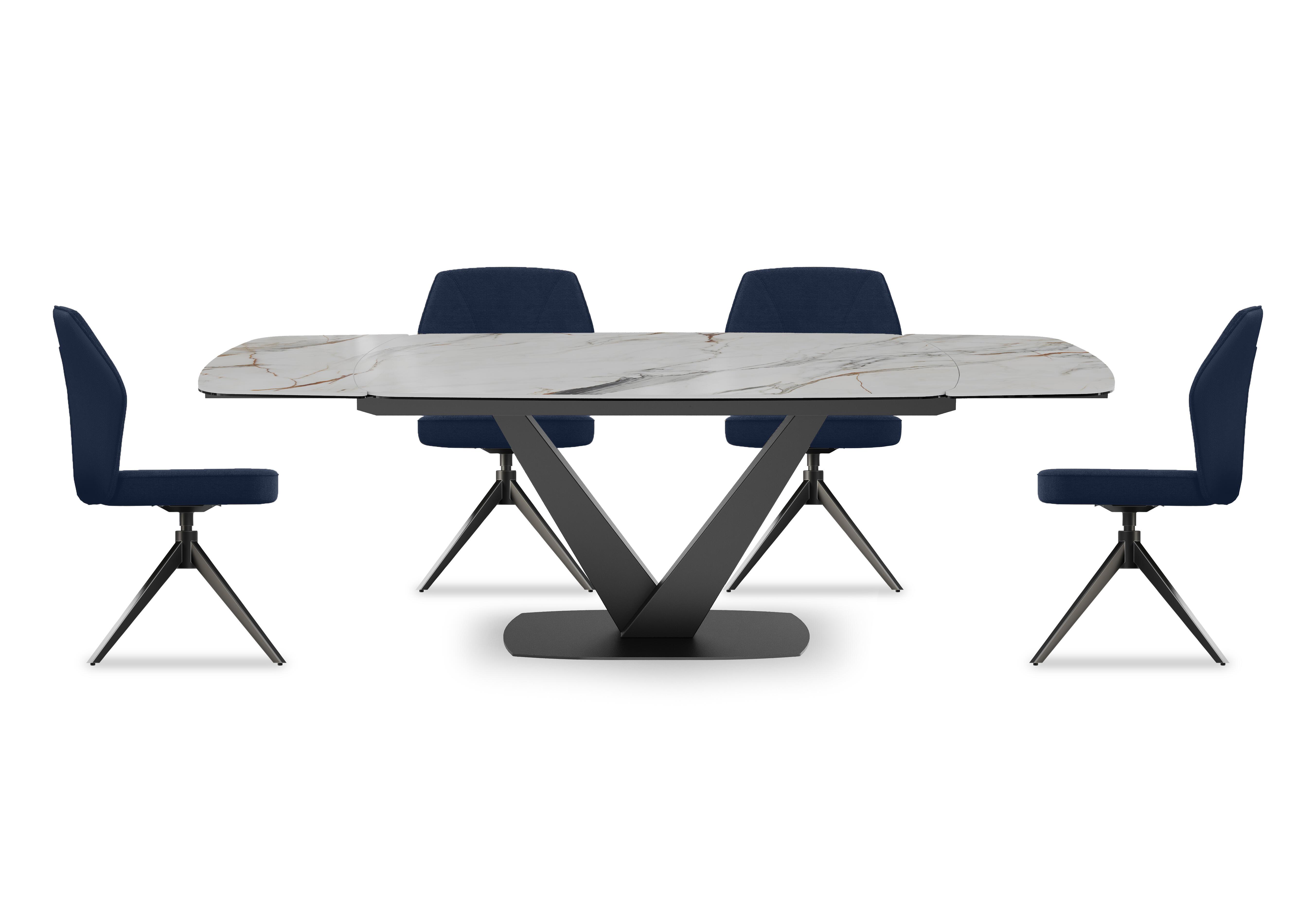 Julio Medium 160cm Draw Leaf Extending Dining Table in Fiorentio Marble Ceramic with 4 Dining Chairs in Navy Blue on Furniture Village