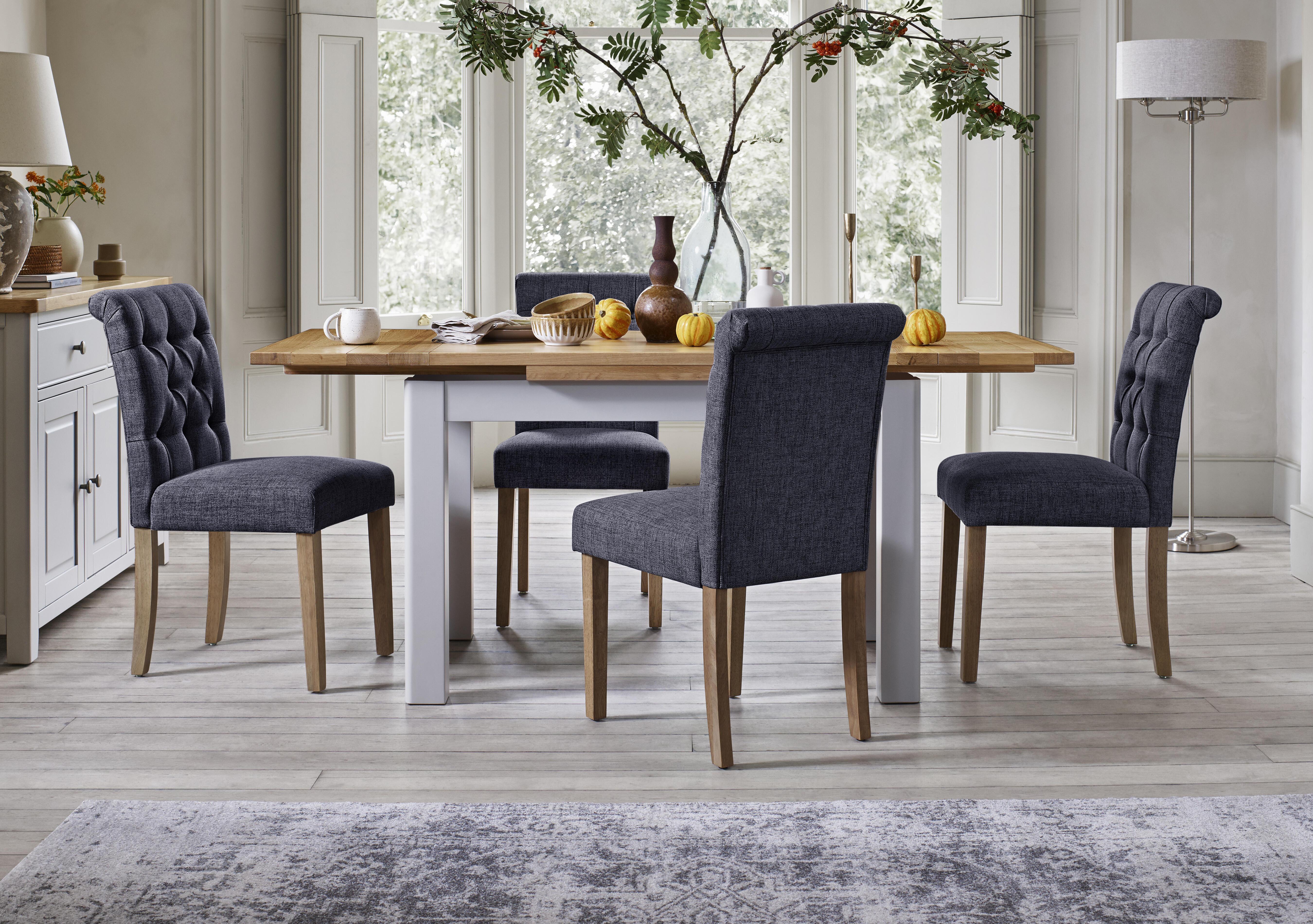 Lewis Large Draw Leaf Extending Dining Table and 4 Button Back Dining Chairs in  on Furniture Village