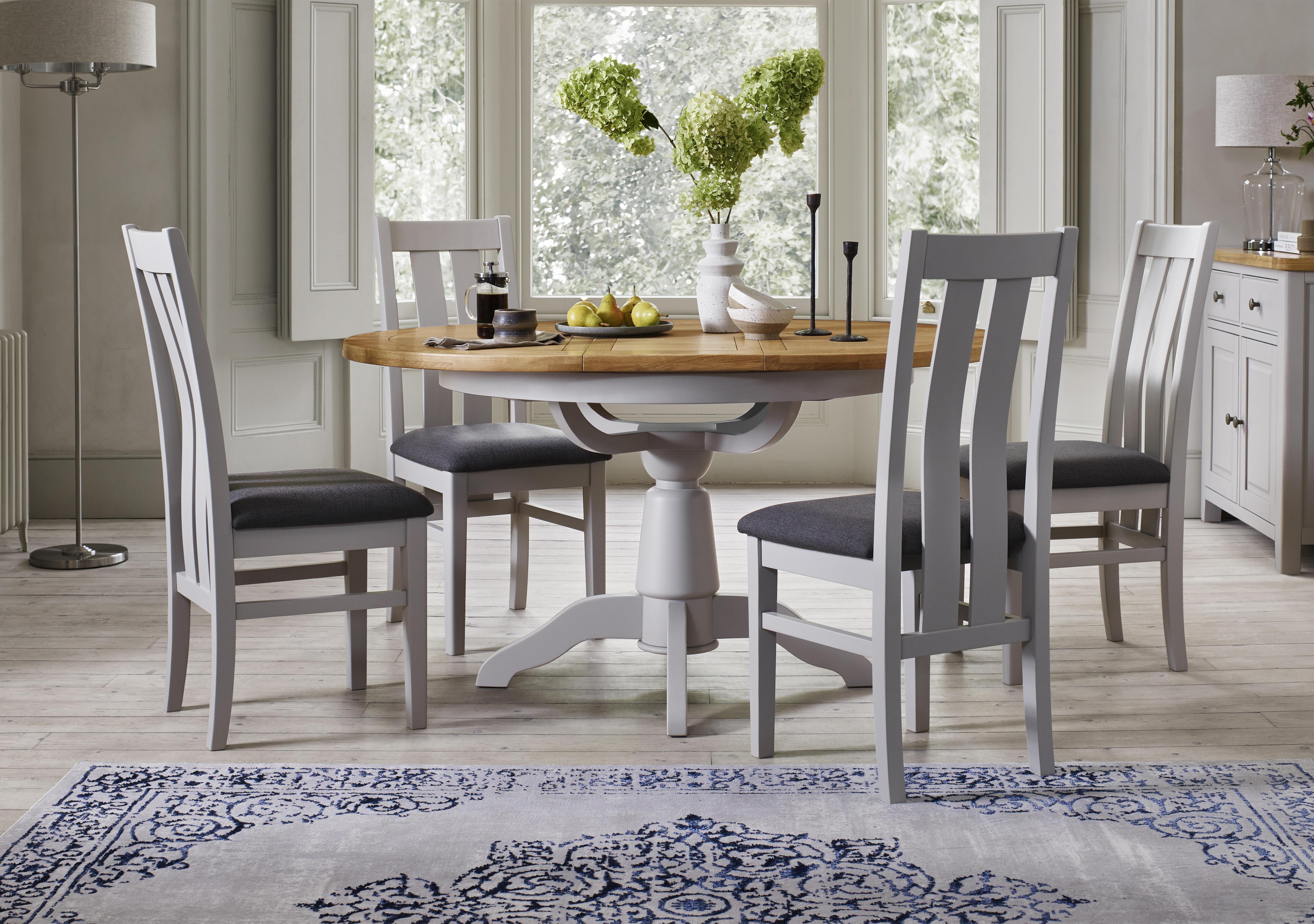 Lewis Round Pedestal Butterfly Extending Dining Table and 4 Wooden Slatted Back Dining Chairs in  on Furniture Village