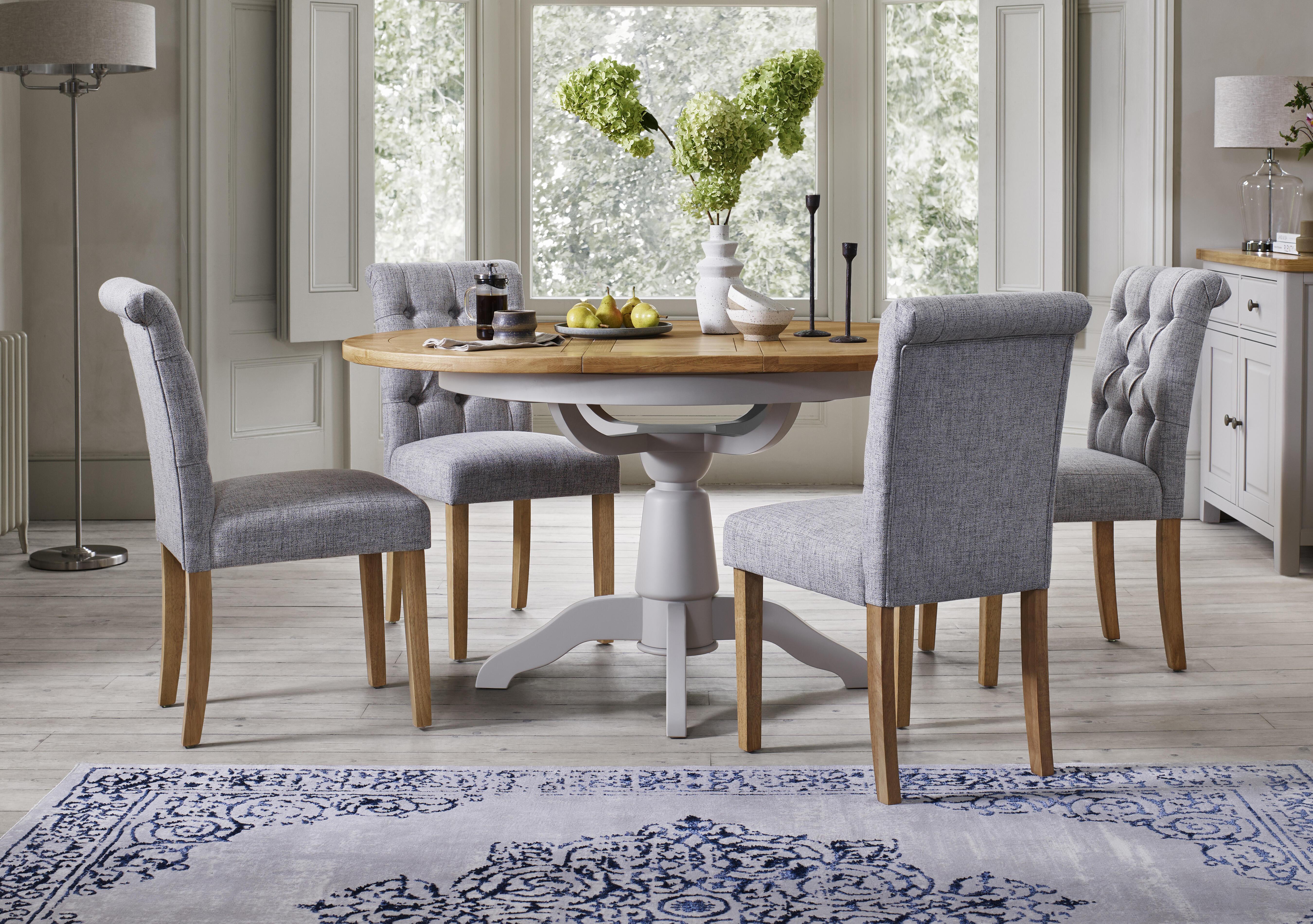 Lewis Round Pedestal Butterfly Extending Dining Table and 4 Button Back Dining Chairs in  on Furniture Village