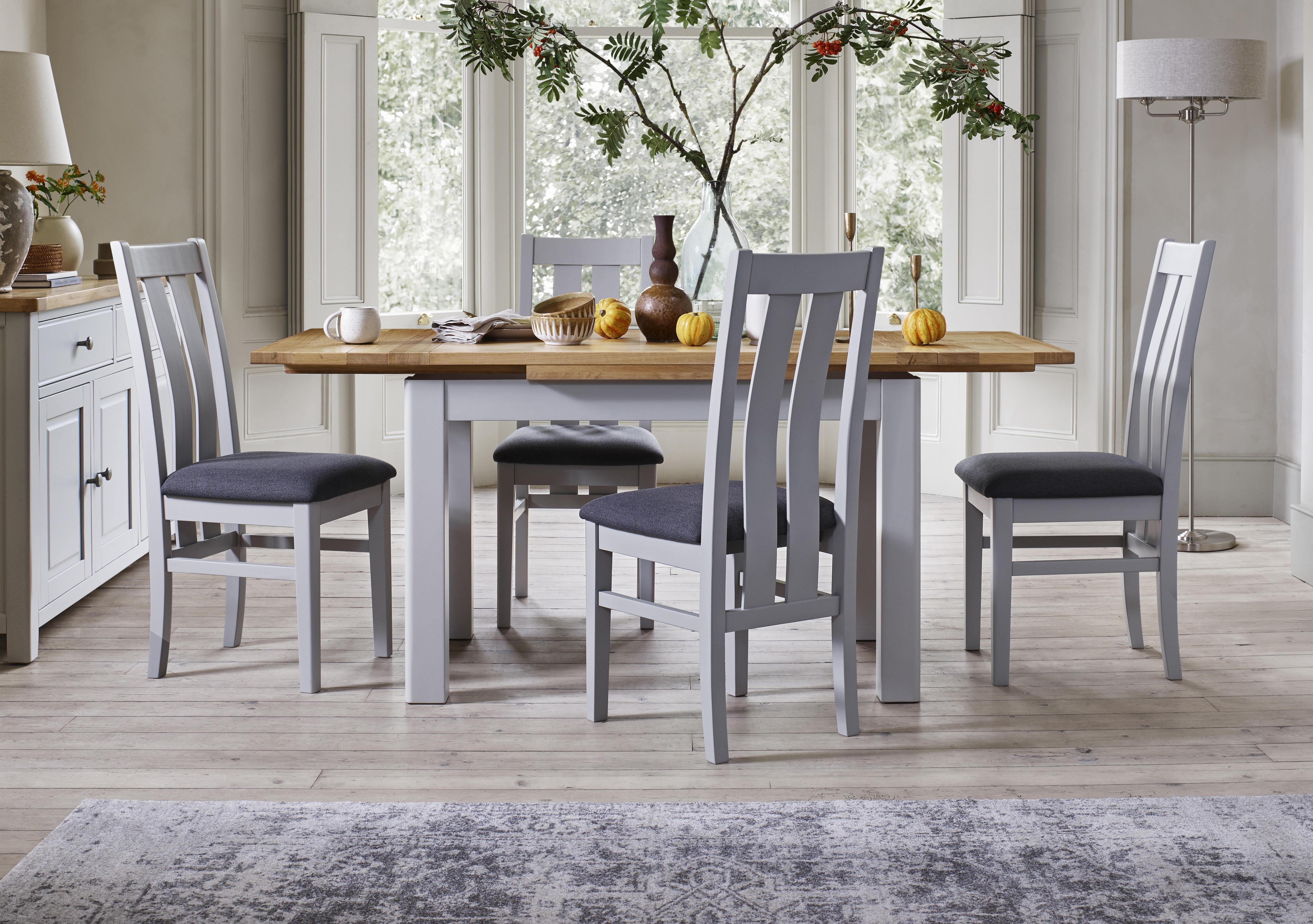 Lewis Large Draw Leaf Extending Dining Table and 4 Wooden Slatted Back Dining Chairs in  on Furniture Village