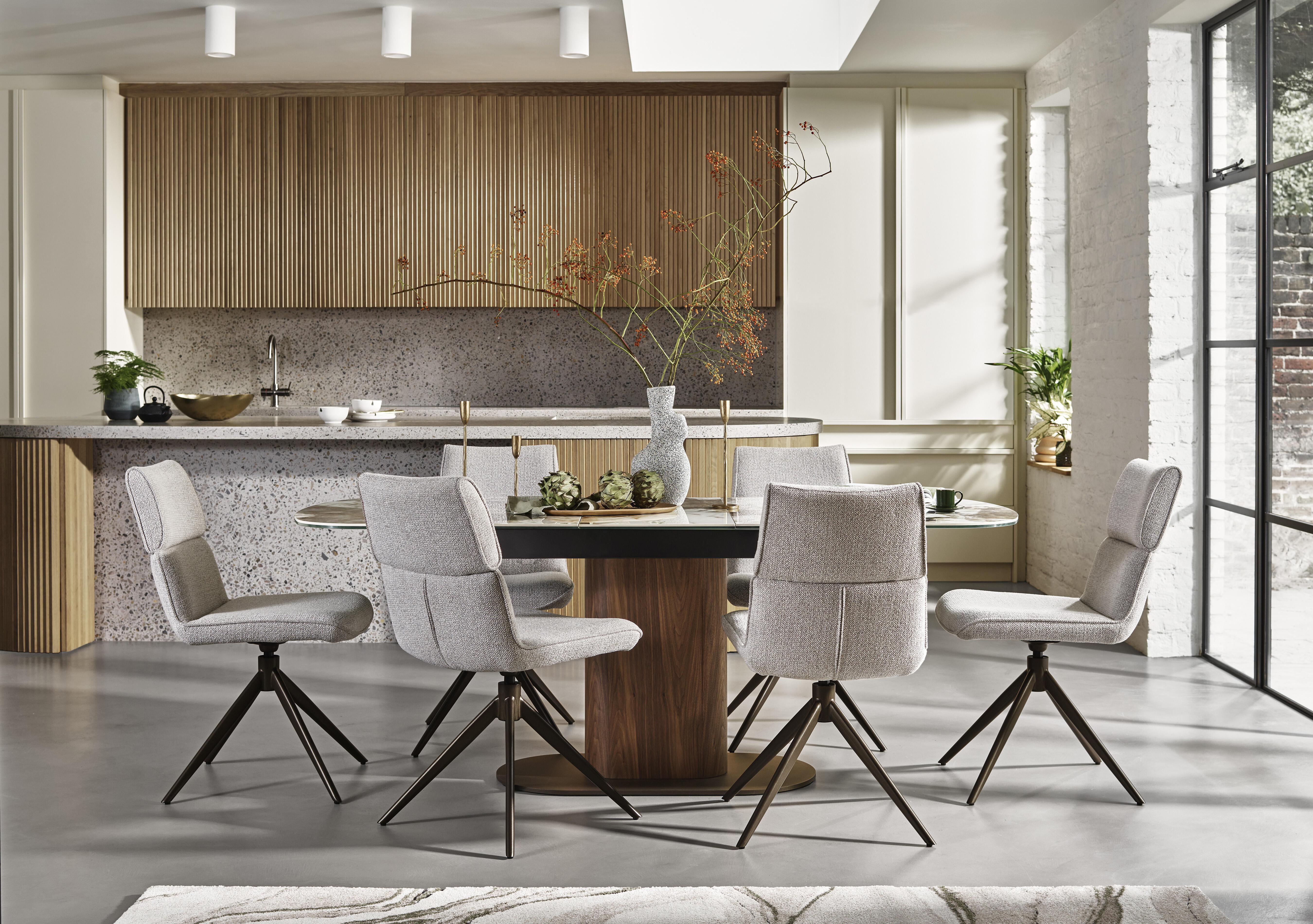 Mekong Extending Dining Table and 6 Fabric Swivel Dining Chairs in  on Furniture Village