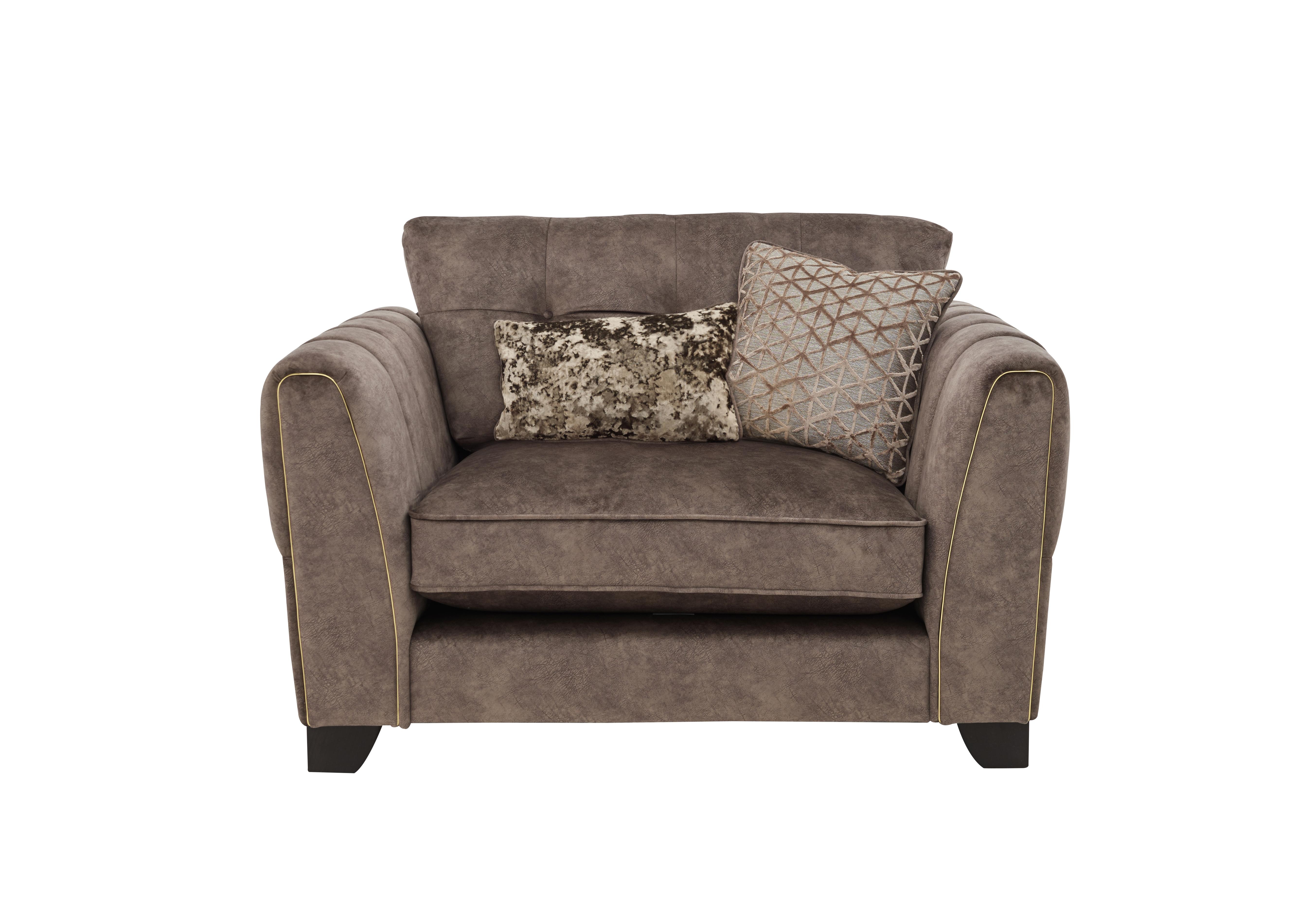 Mariah Classic Back Fabric Snuggler Chair in Dapple Chocolate-Tri Brass on Furniture Village