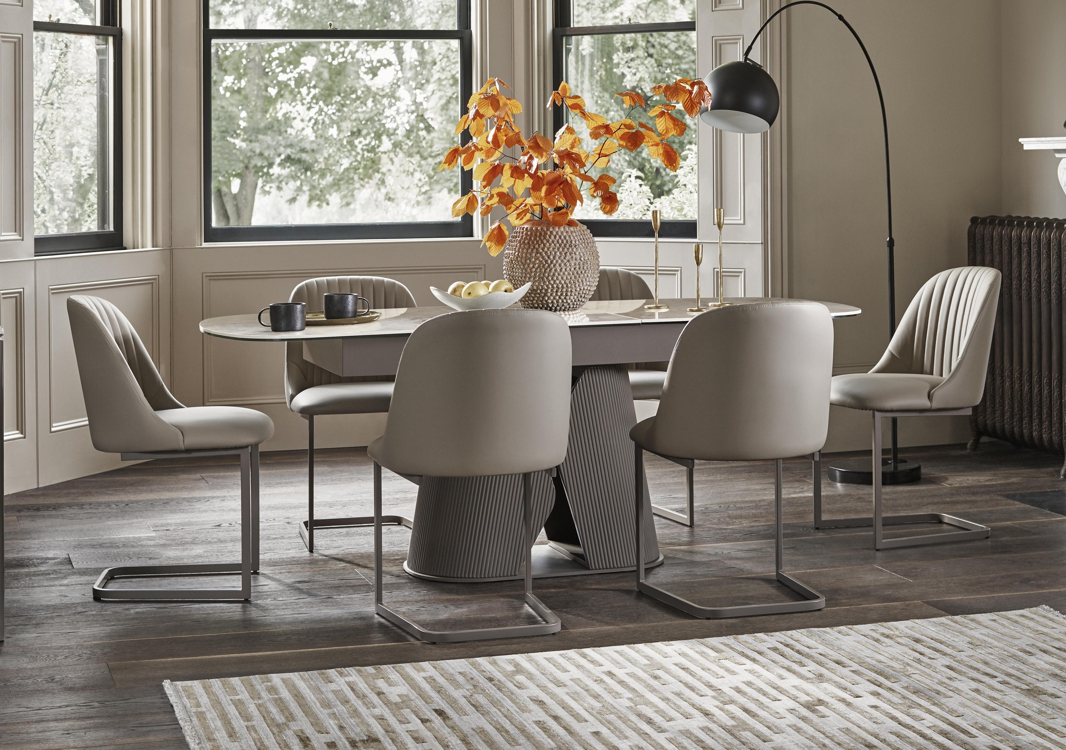 Ivy Extending Dining Table and 6 Cantilever Dining Chairs in  on Furniture Village