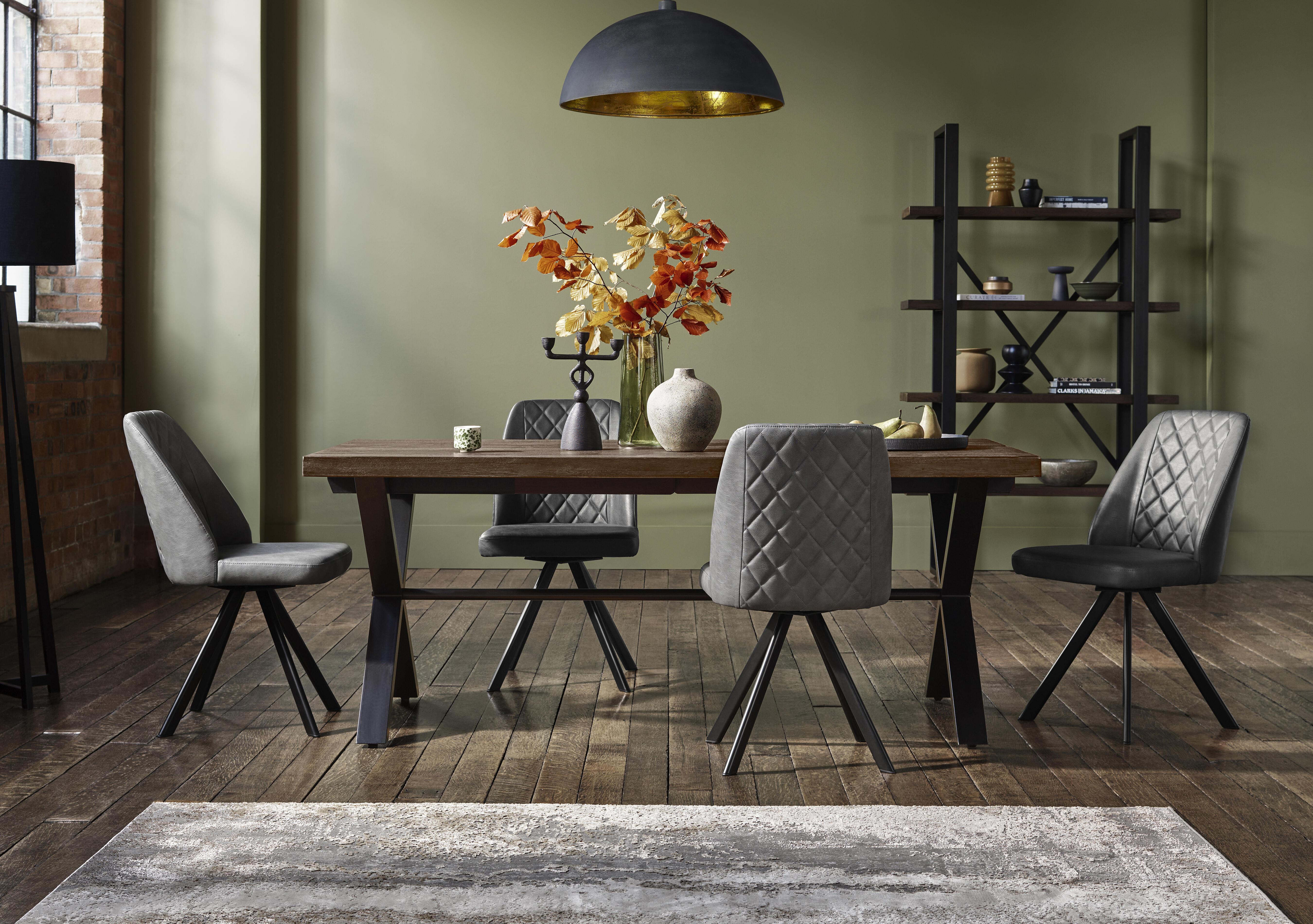 Jupiter Dining Table with X Shaped Legs and 4 Swivel Dining Chairs in  on Furniture Village