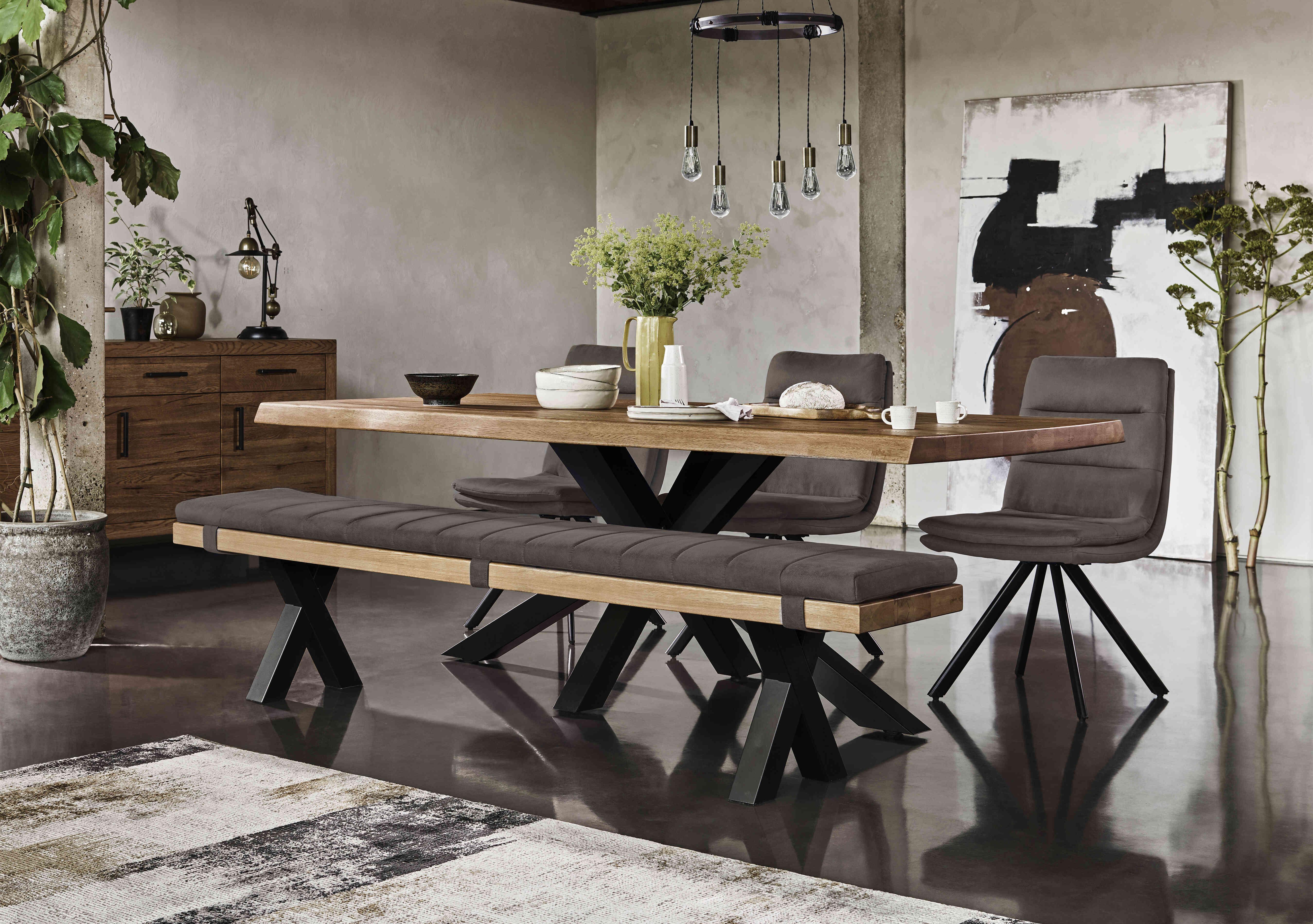 Njord Raw Edge Dining Table with Metal Star Base, Dining Bench and 3 Anthracite Fabric Swivel Dining Chairs in  on Furniture Village