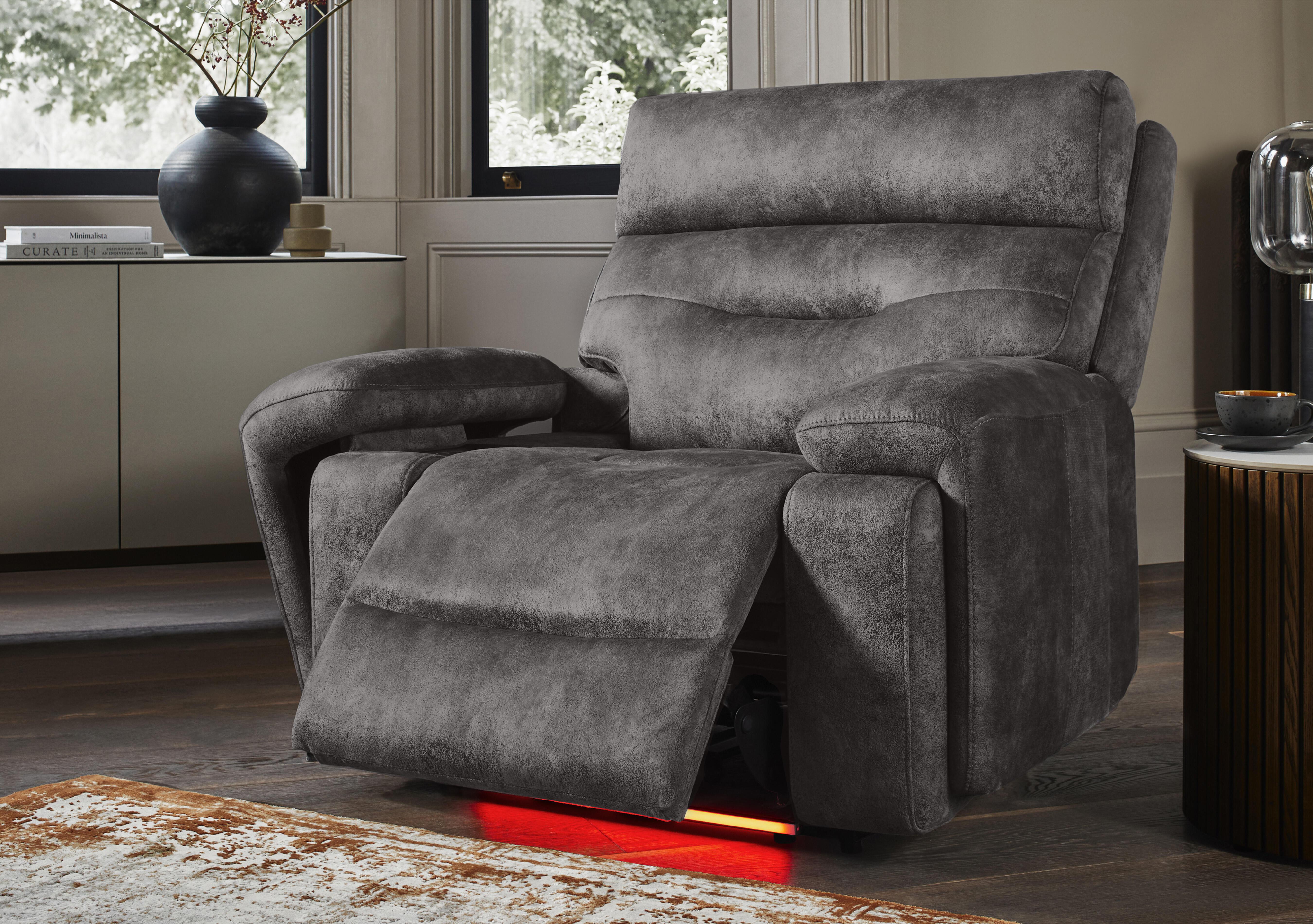 Cinemax Fabric Media Arm Power Recliner Chair with Power Headrest in  on Furniture Village