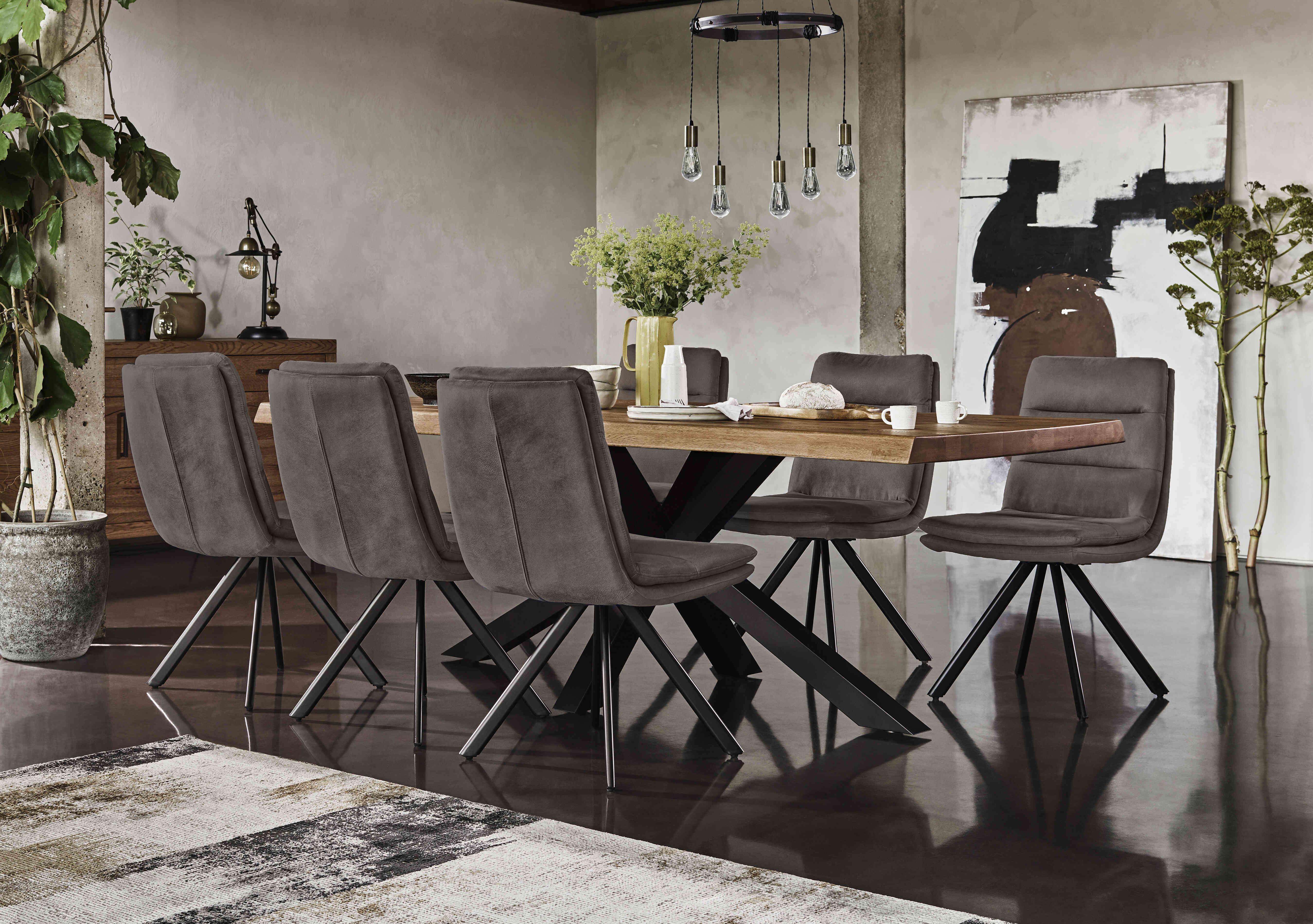 Njord Raw Edge Dining Table with Metal Star Base and 6 Anthracite Fabric Swivel Dining Chairs in  on Furniture Village