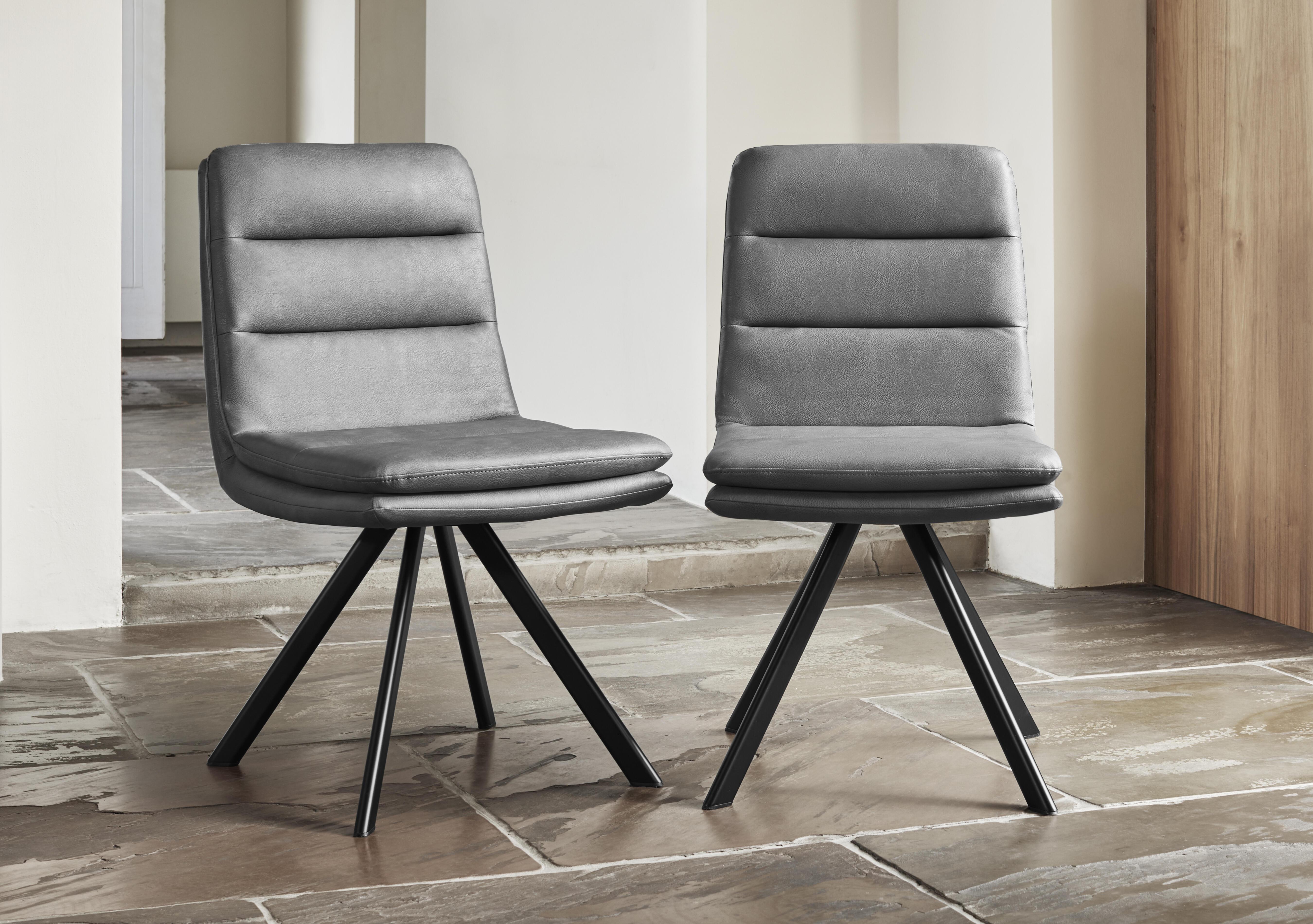 Njord Pair of Faux Leather Swivel Dining Chairs in  on Furniture Village