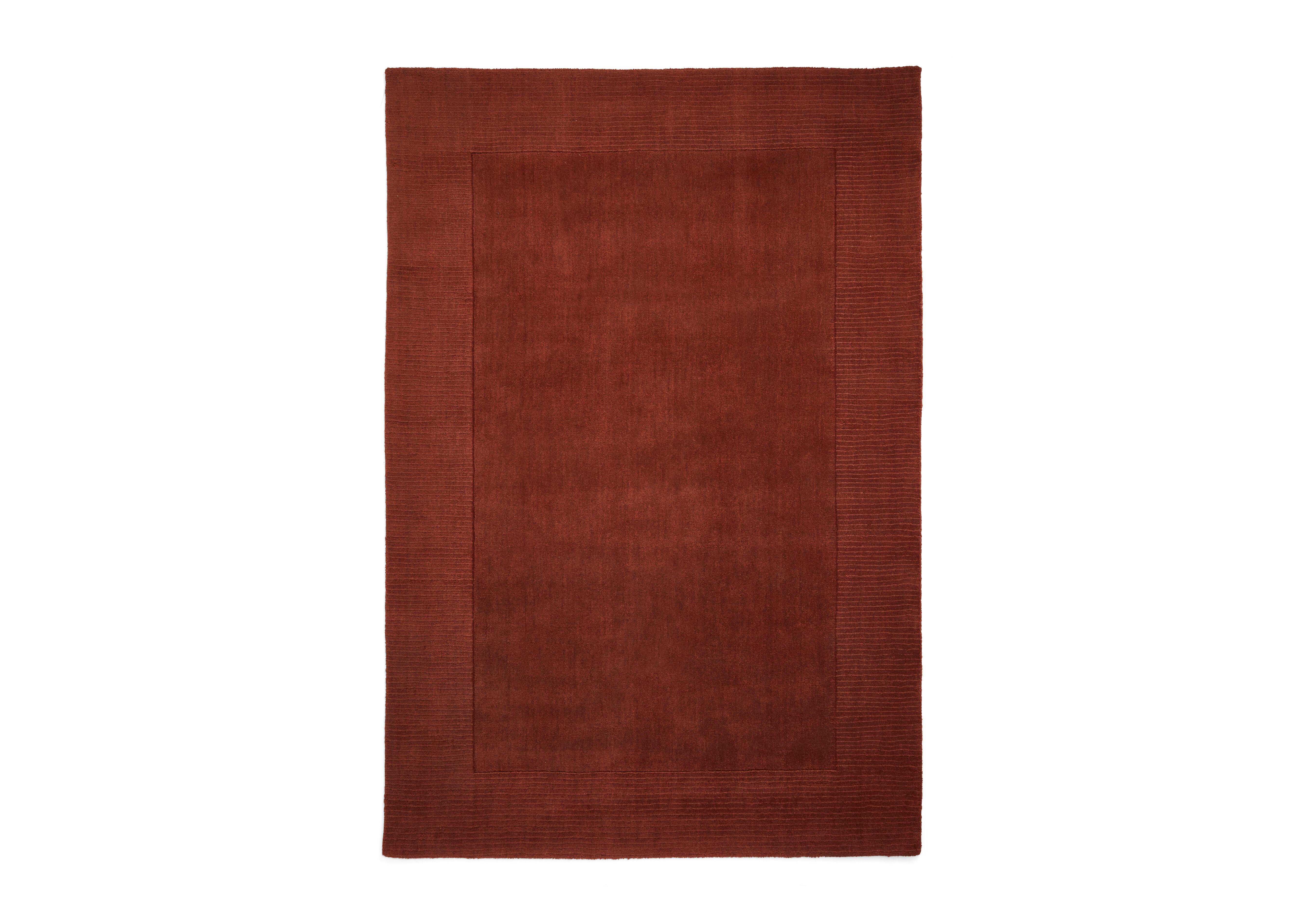 Langford Wool Border Rug in Terracotta on Furniture Village