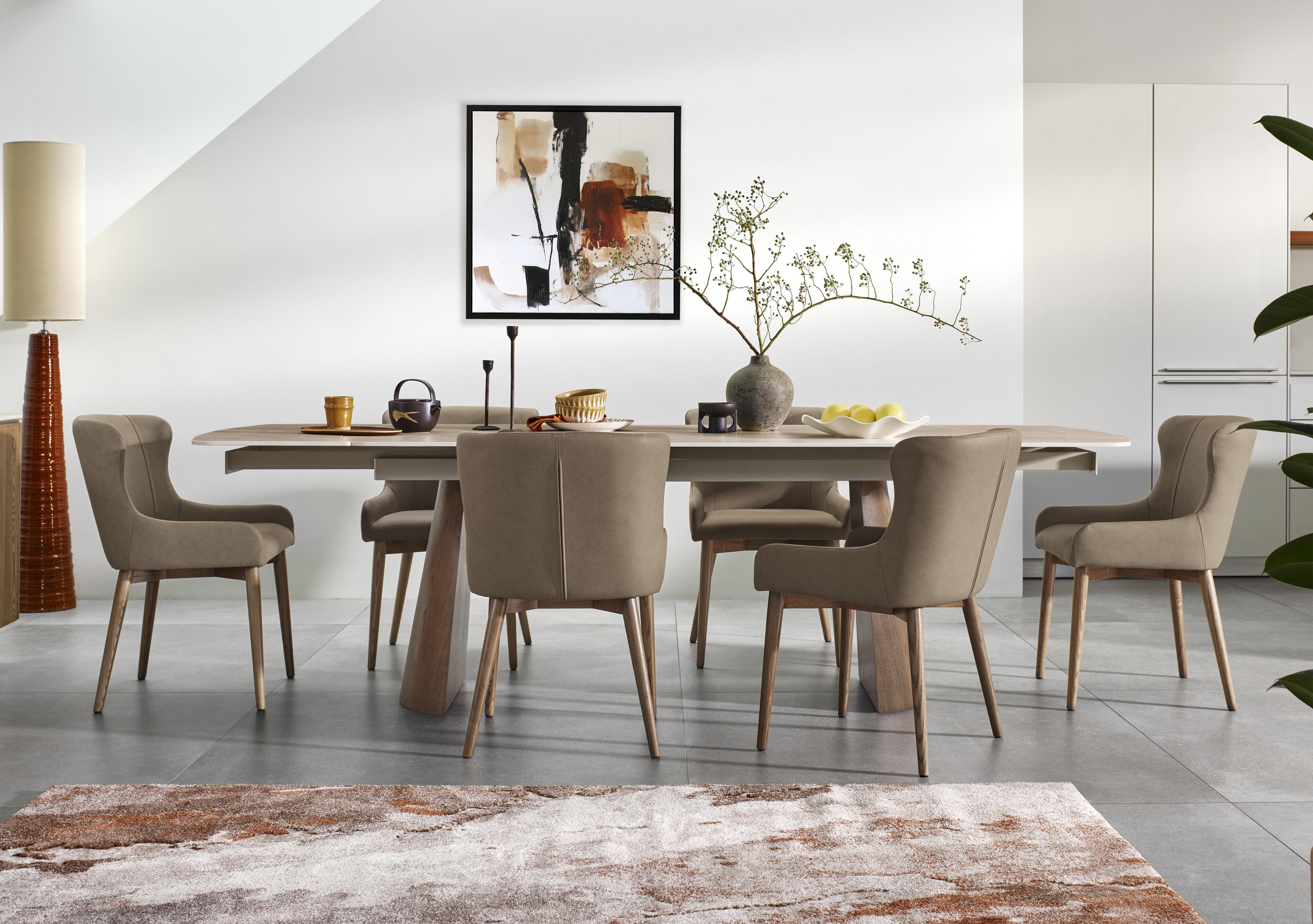 Sansa Rectangular Draw Leaf Extending Dining Table and 6 Faux Leather Dining Chairs with Wooden Legs in  on Furniture Village