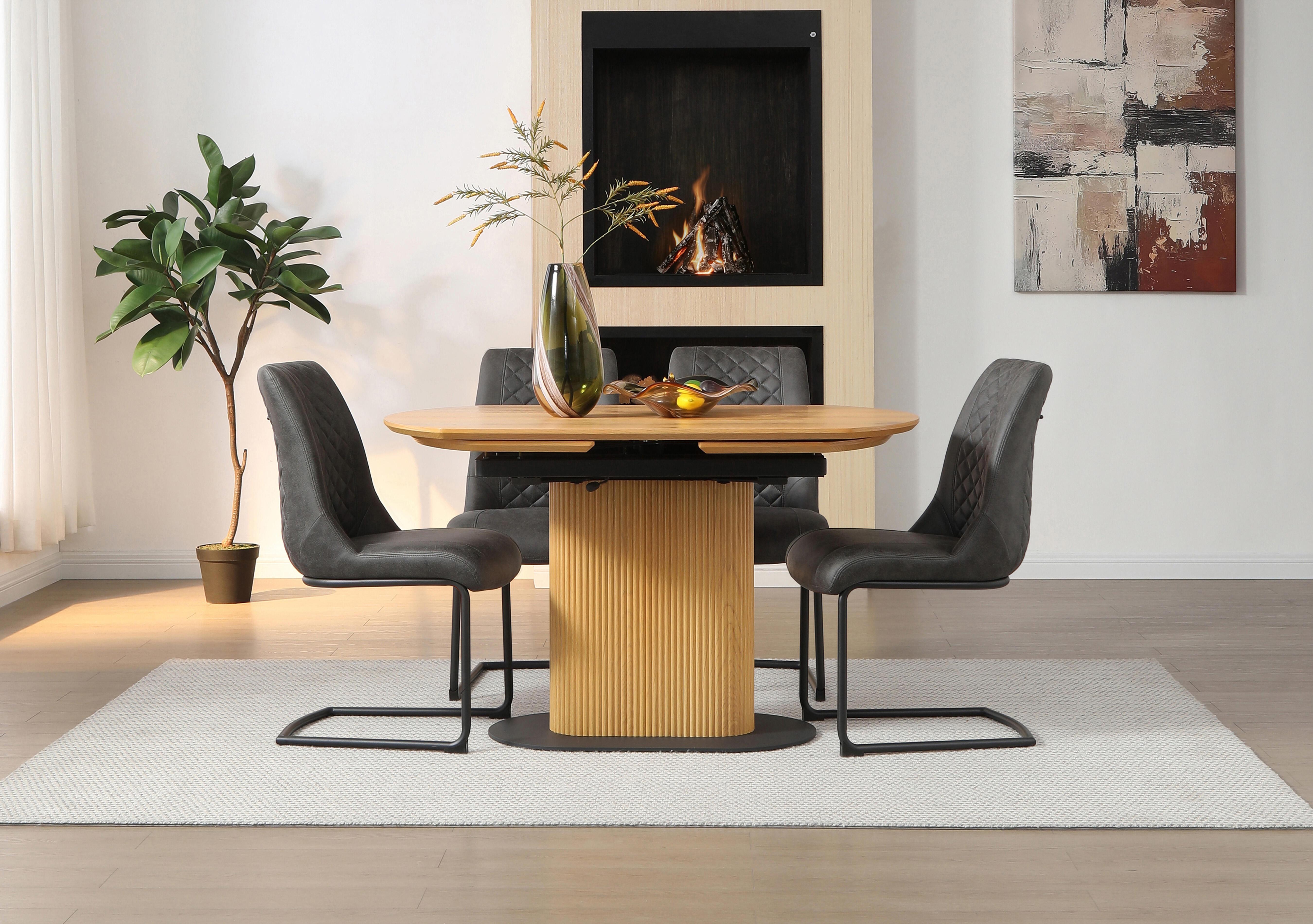 Jayden Swivel Extending Dining Table and 4 Faux Leather Cantilever Dining Chairs in  on Furniture Village