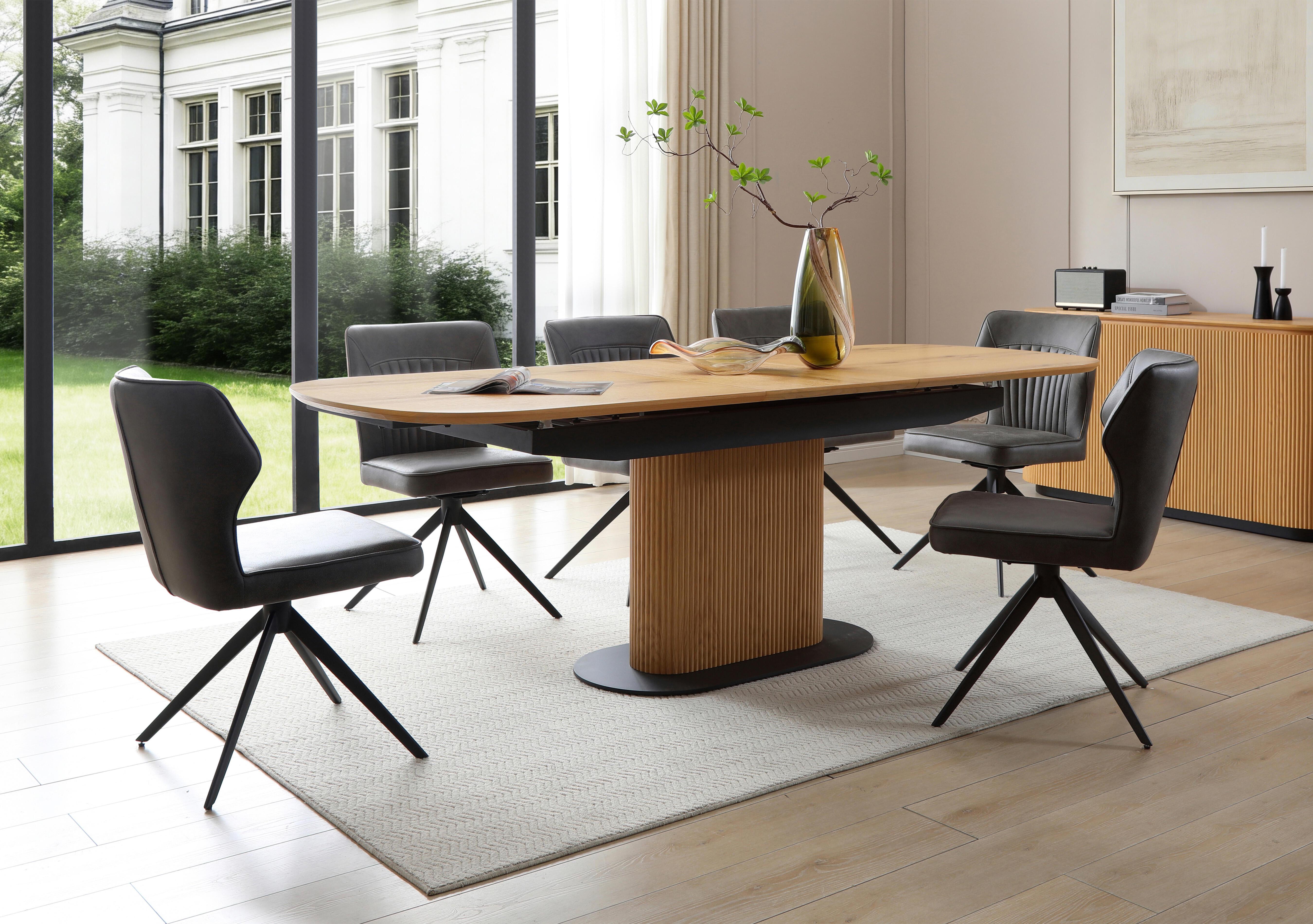Jayden Pop Up Extending Dining Table and 6 Faux Leather Swivel Dining Chairs in  on Furniture Village